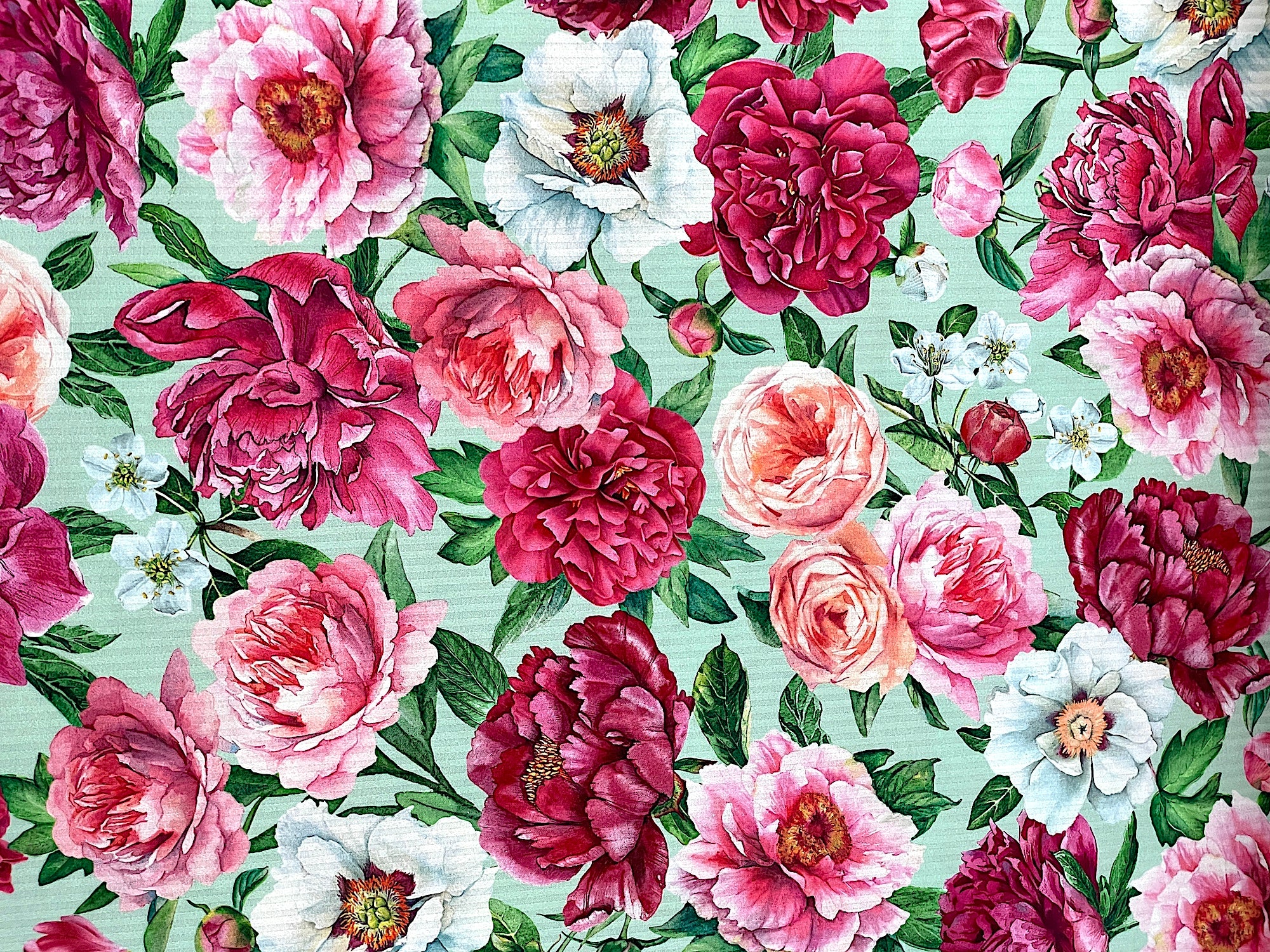 This green fabric is part of the Blush collection by Northcott Fabrics.&nbsp; You will find several shades of pink peonies, white peonies and peach roses.