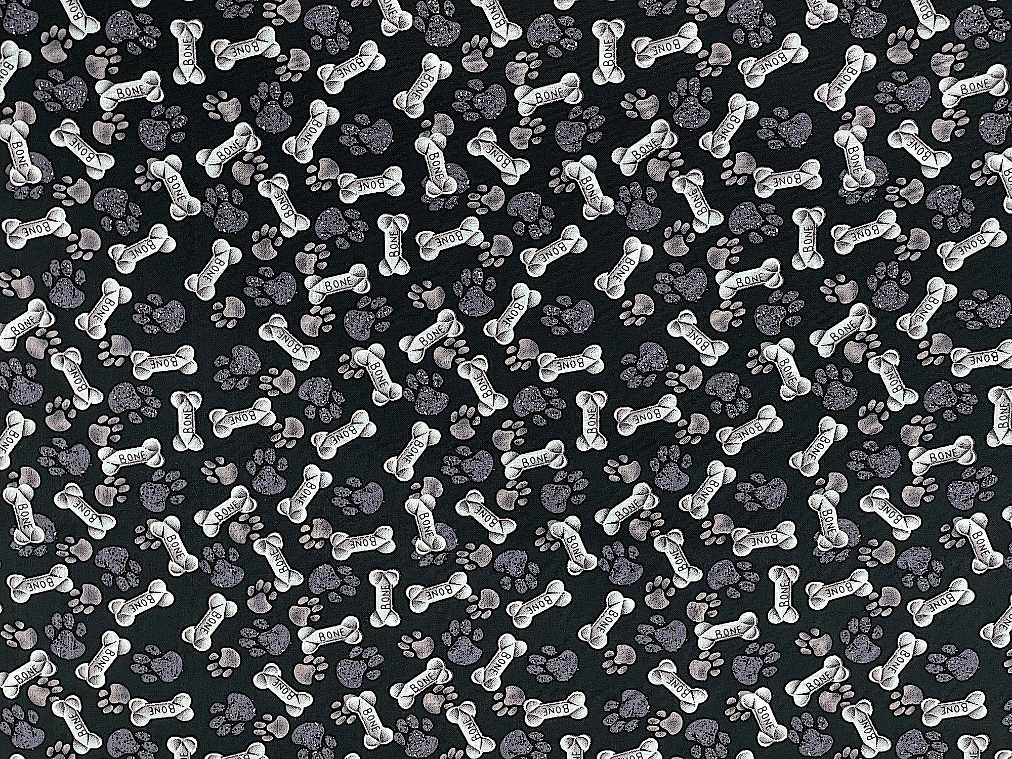 This fabric is called Paws & Bones. This black cotton fabric is covered with dark grey paw prints and dog bones that say bone on them.