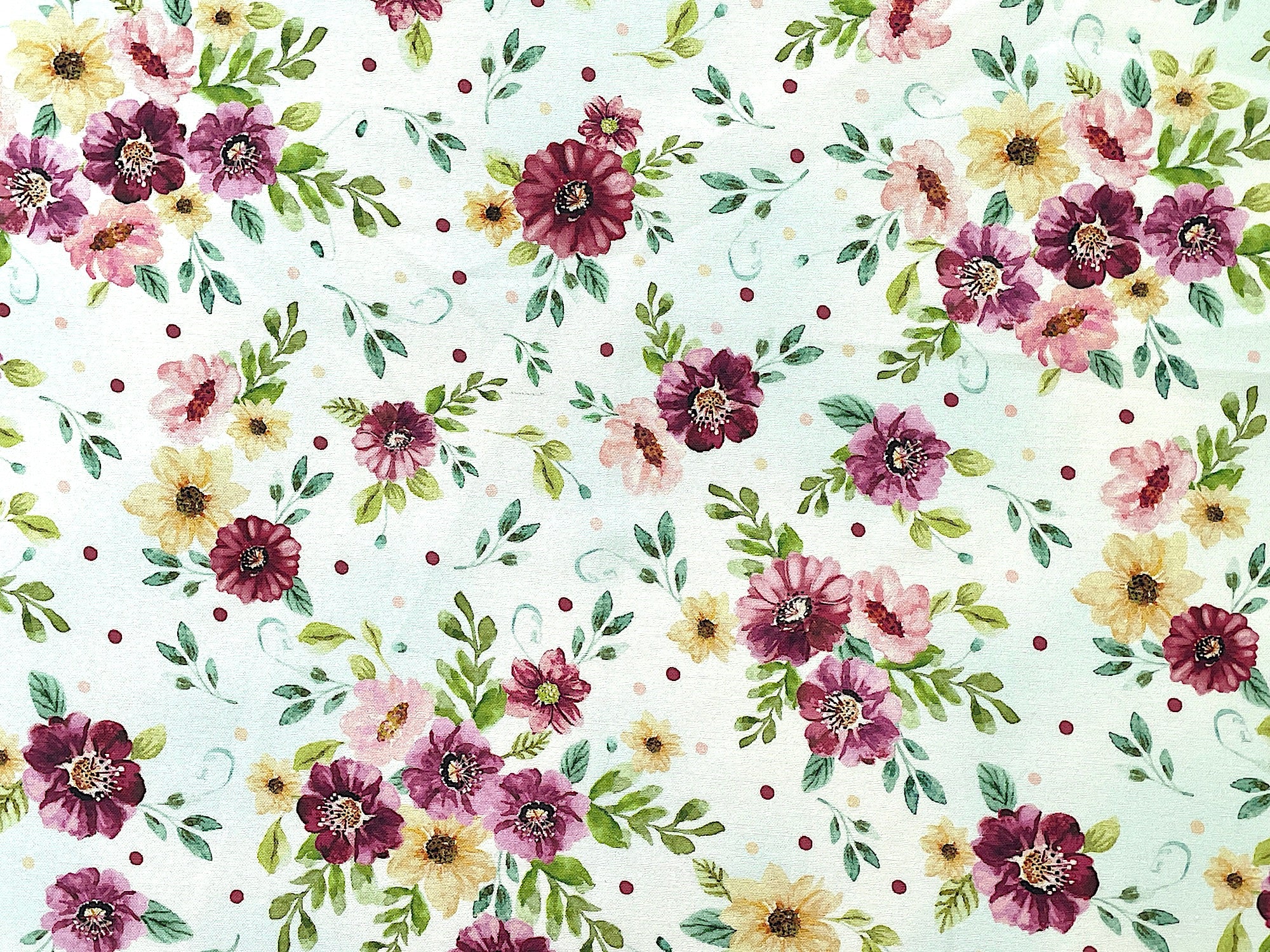 This fabric is part of the Sew in Love Collection by Rockstar Sewing.  This white cotton fabric is covered with pink, red and yellow flowers and green leaves
