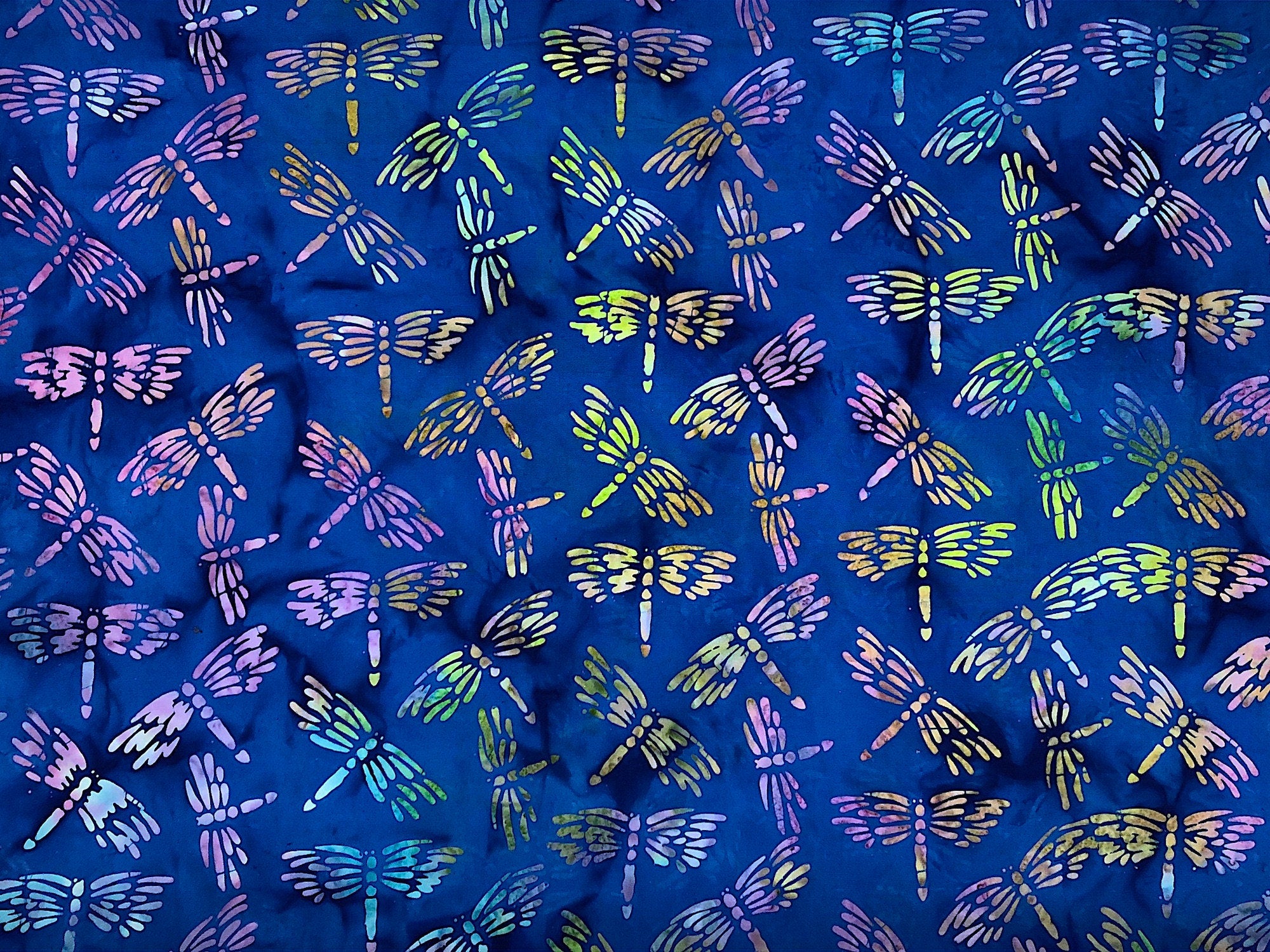This dragonfly fabric is part of the lemon grass collection by Island Batik. The dragonflies are a combination of yellow, pink, blue and green. This fabric is called Dragonfly Royal Blue