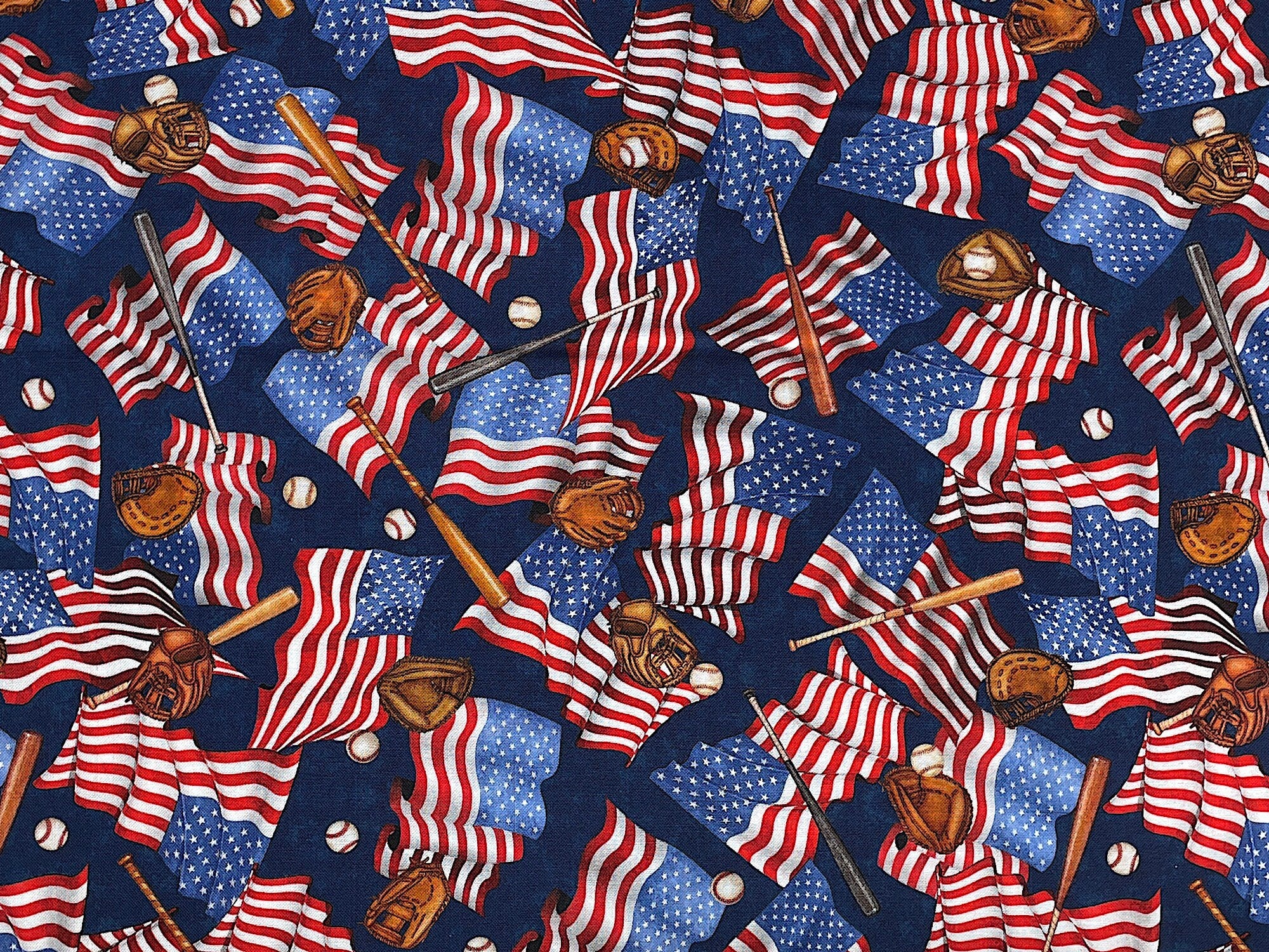Cotton fabric covered with USA flags, baseball bats, balls and gloves.