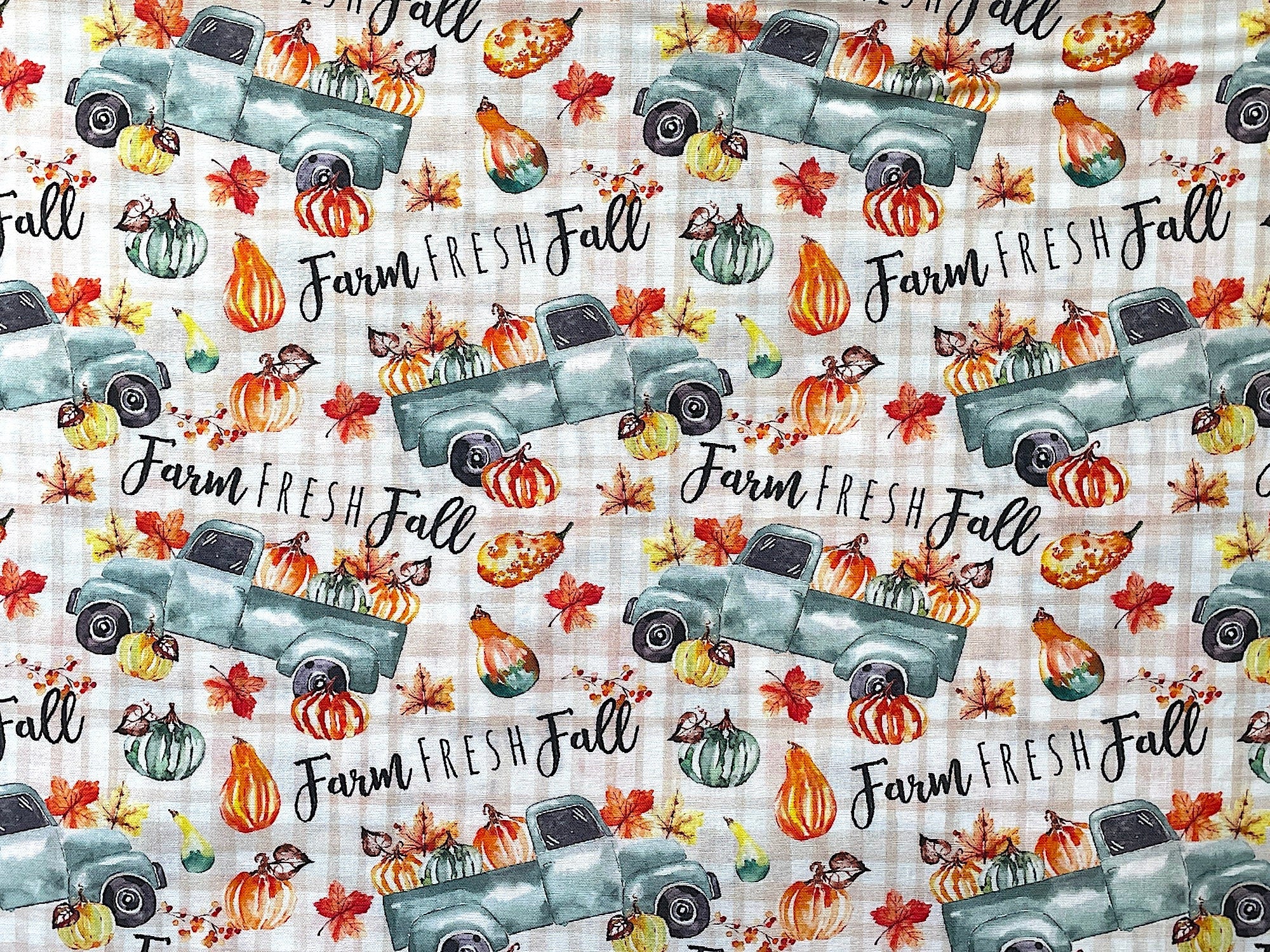 This fall fabric is covered with trucks, pumpkins and leaves. This fabric is called Farm Fresh Fall Trucks.