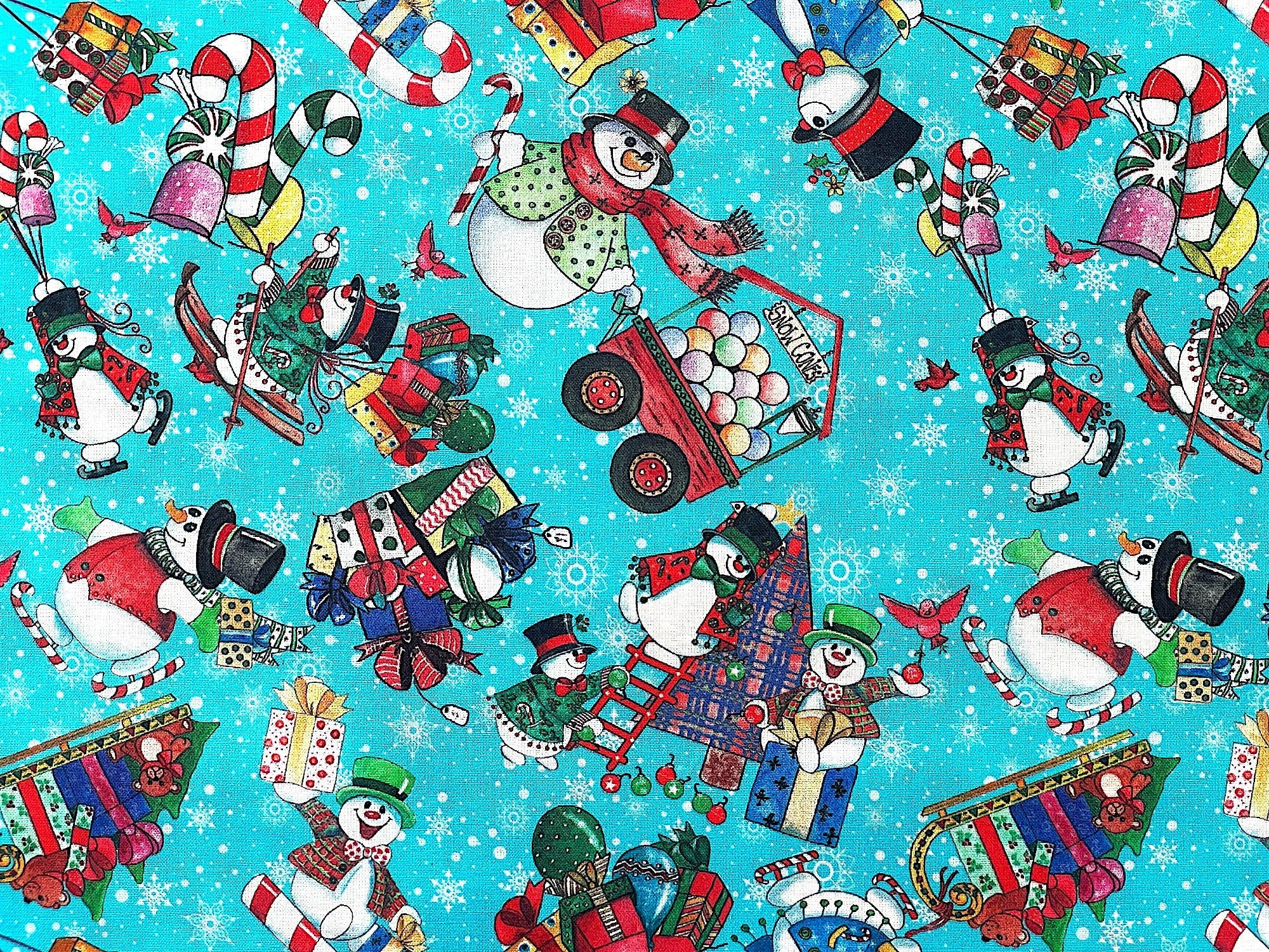 This fabric is part of the Snowman Follies collection. This blue fabric is covered with snowmen, trees, presents, candy canes and more. Some of the snowmen are decorating trees, pulling sleds, walking in candy cane skis and more.