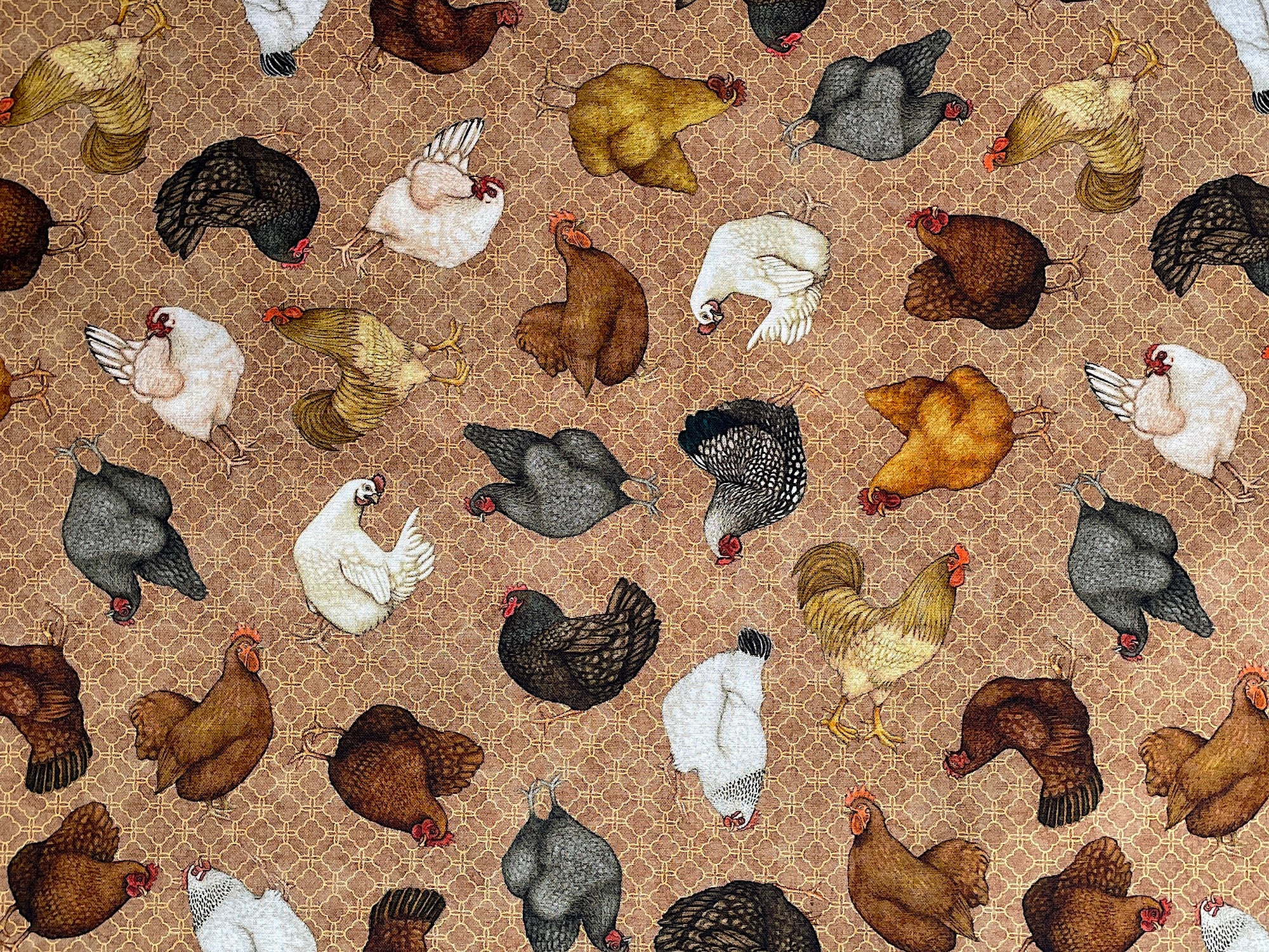 Brown cotton fabric covered with chickens.