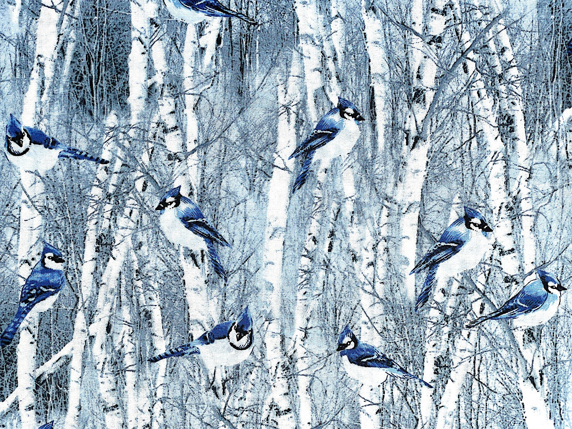 Cotton fabric covered with blue birds in trees.