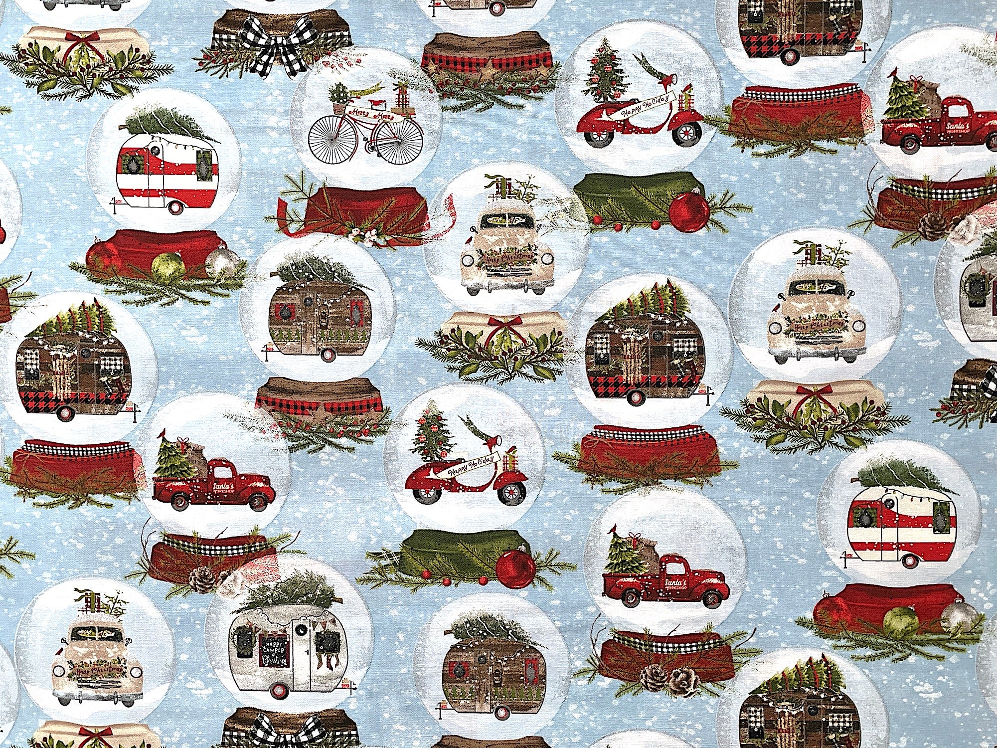 Blue cotton fabric covered with snow globes that are filled with red trucks, RV's motorbikes and more.