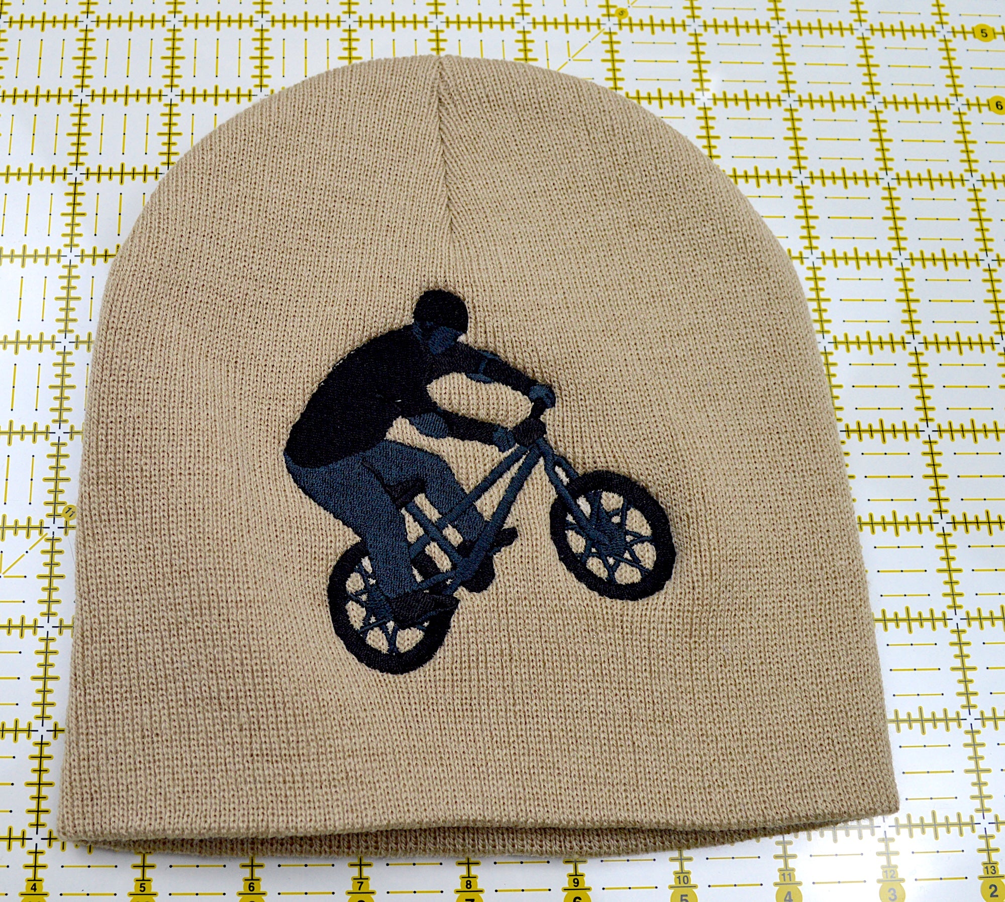 Bicycle Rider Embroidered Cuffless Beanie Hat