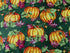 This fabric is called Colors of Fall and is covered with pumpkins and leaves. The background is a olive green.