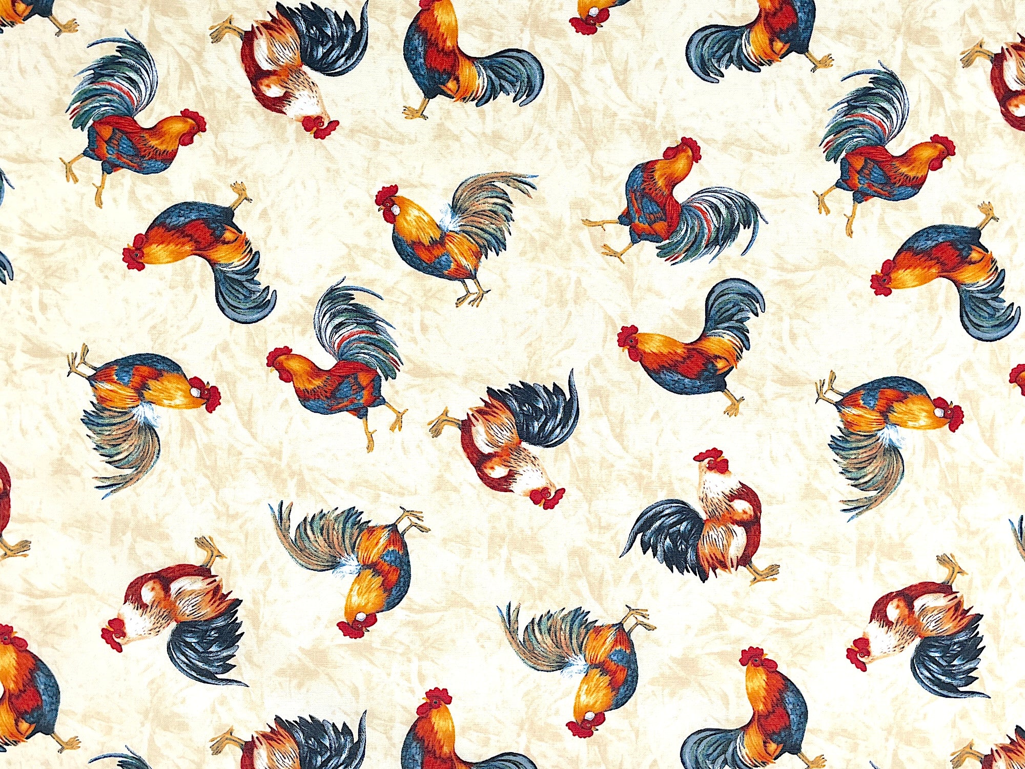 Cream colored cotton fabric covered with roosters.