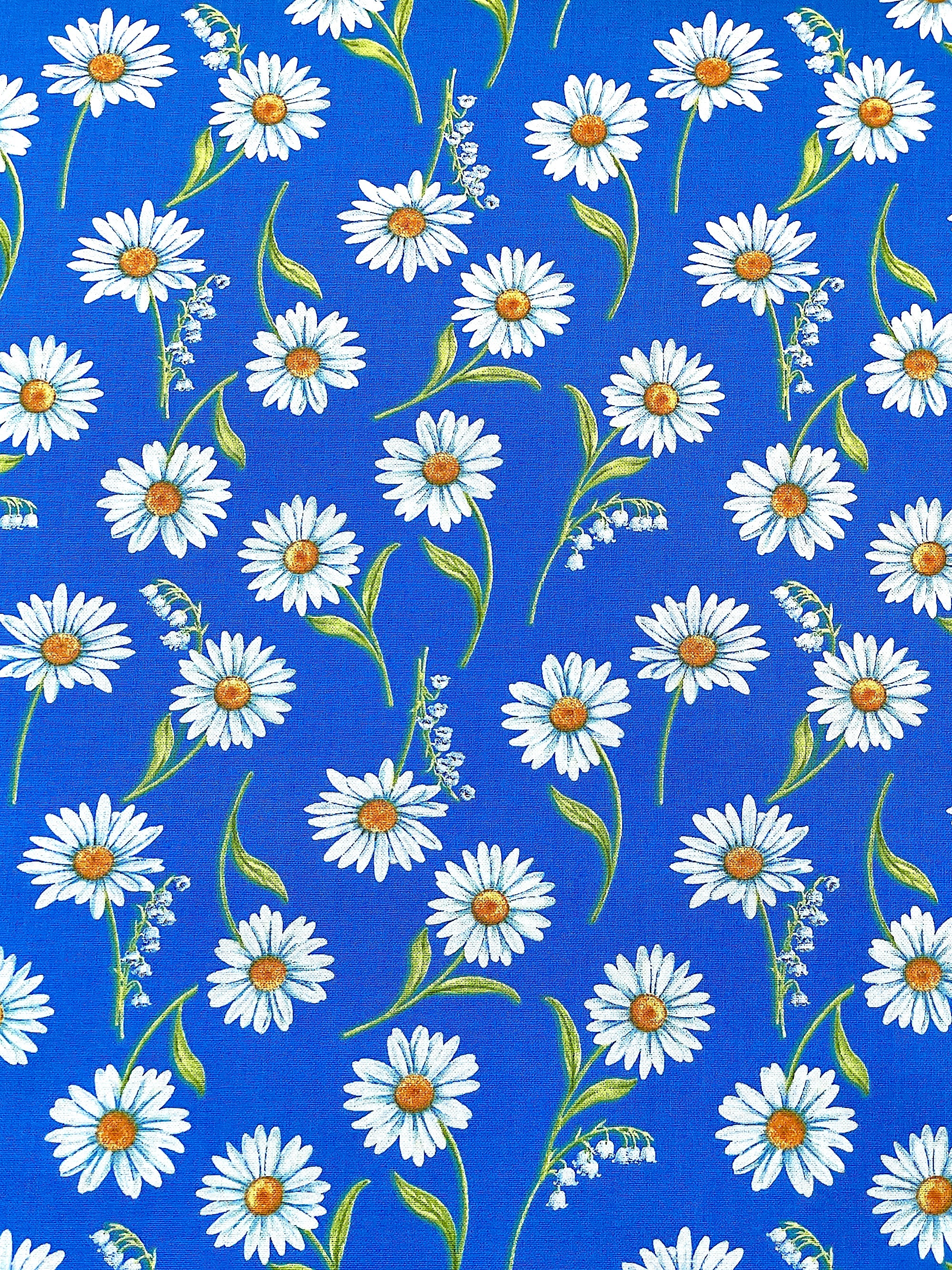 This cotton fabric is covered with white Daisies.&nbsp; This fabric is part of the Blue &amp; White Elegance collection by Benartex.