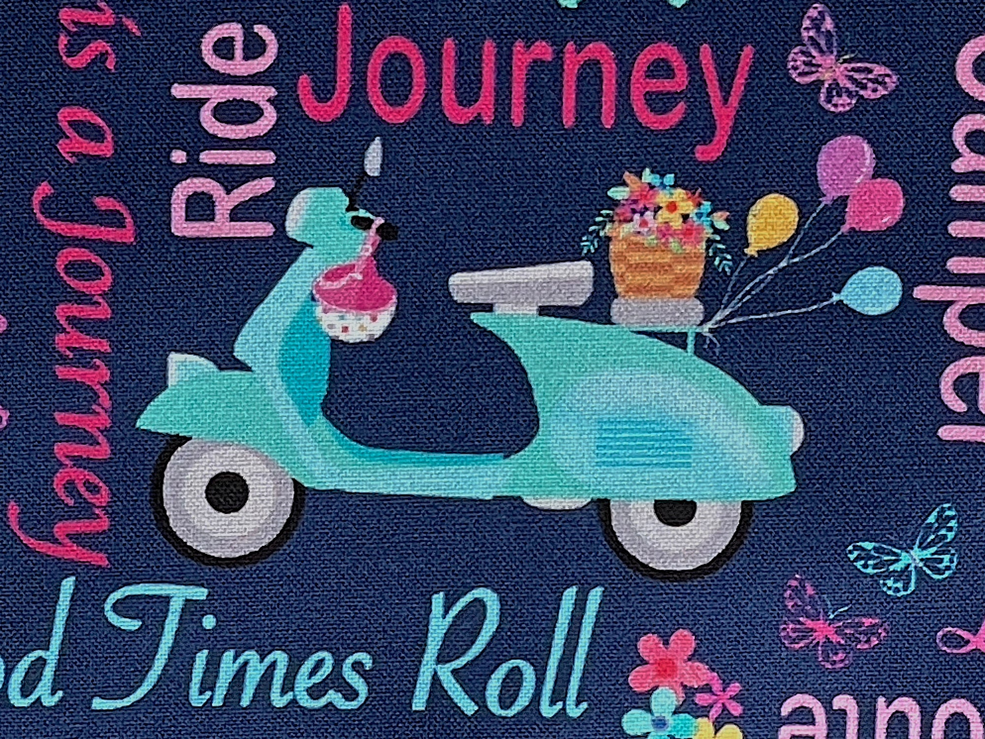 Close up of scooter and words such as journey and ride.