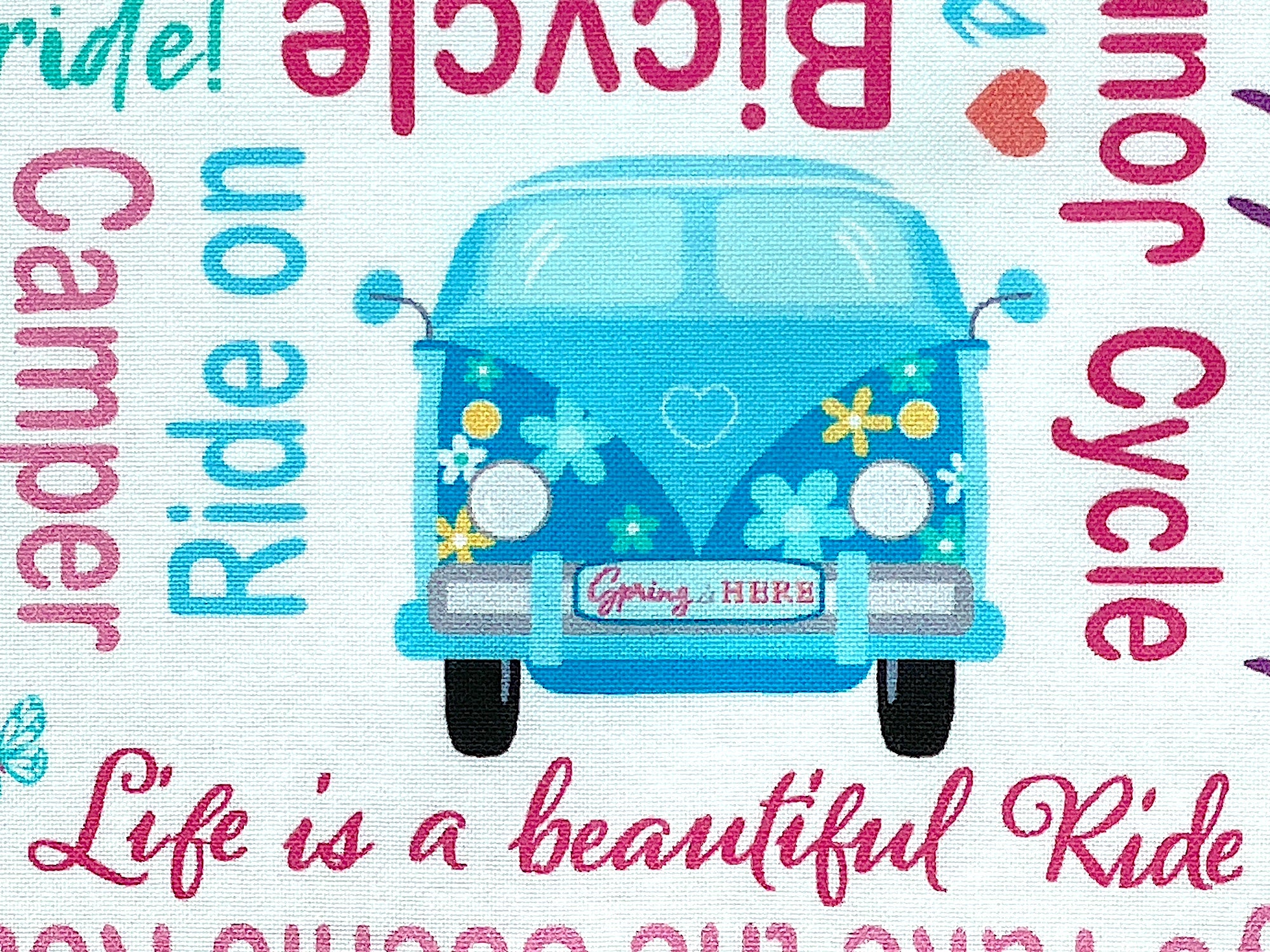 Close up of a VW Bug with spring is here on the license plate.