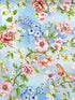 Blue cotton fabric covered with birds sitting on branches of camellias.