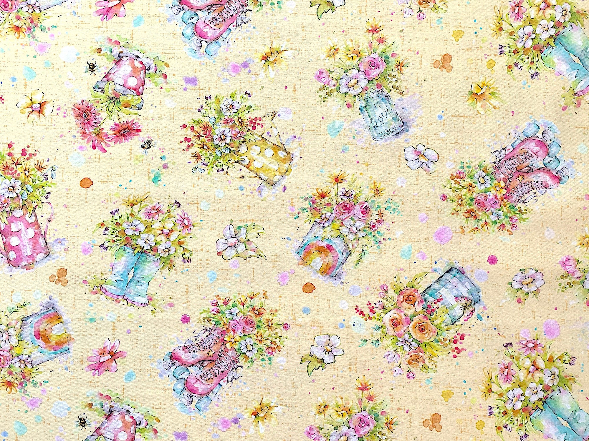 This yellow fabric is part of the Boots &amp; Blooms collection by P&amp;B Textiles. This fabric is covered with&nbsp; &nbsp;vases, skates and boots filled with flowers.&nbsp;