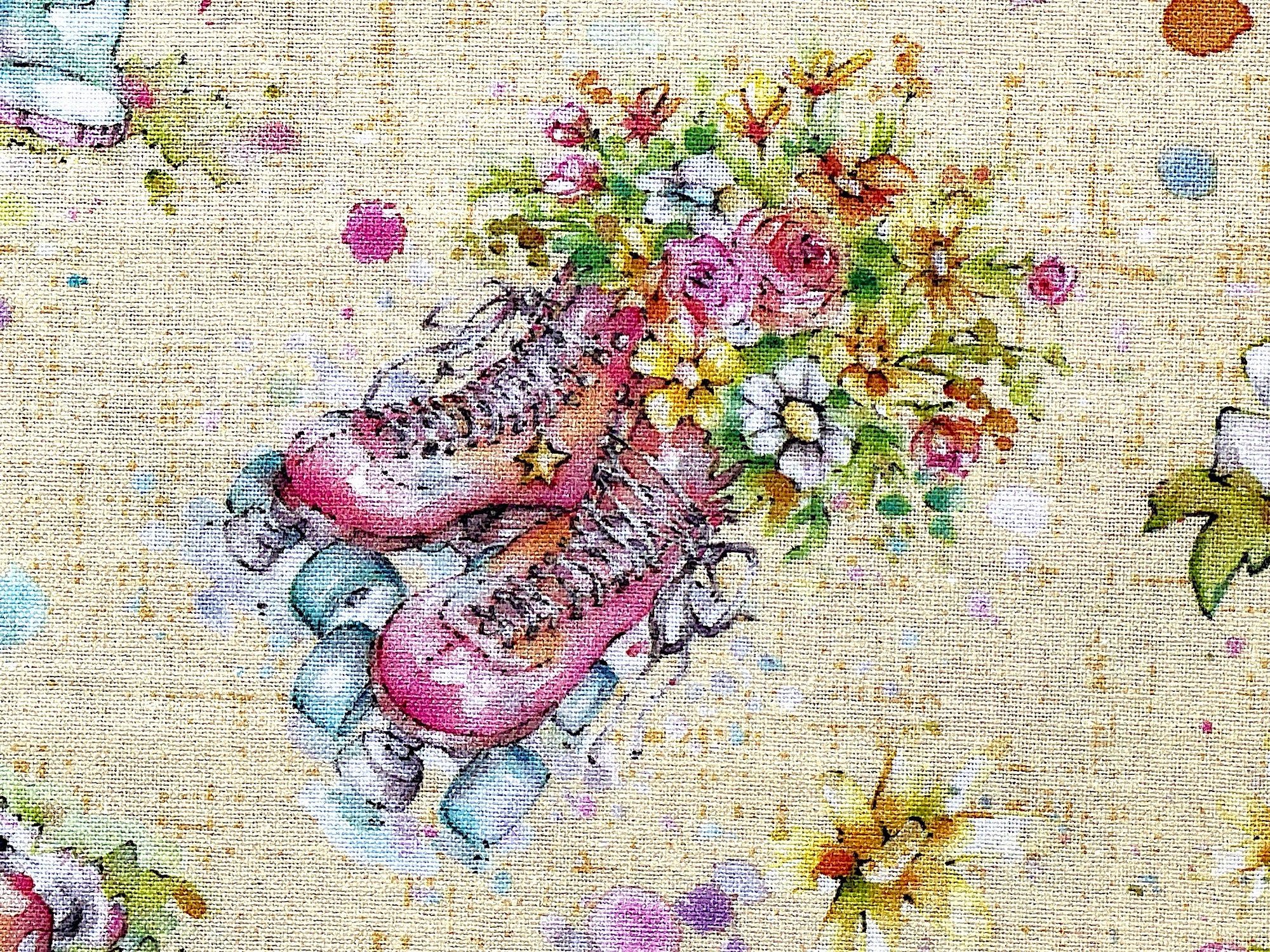 Close up of a pair of a pink set of roller skates that are filled with flowers.