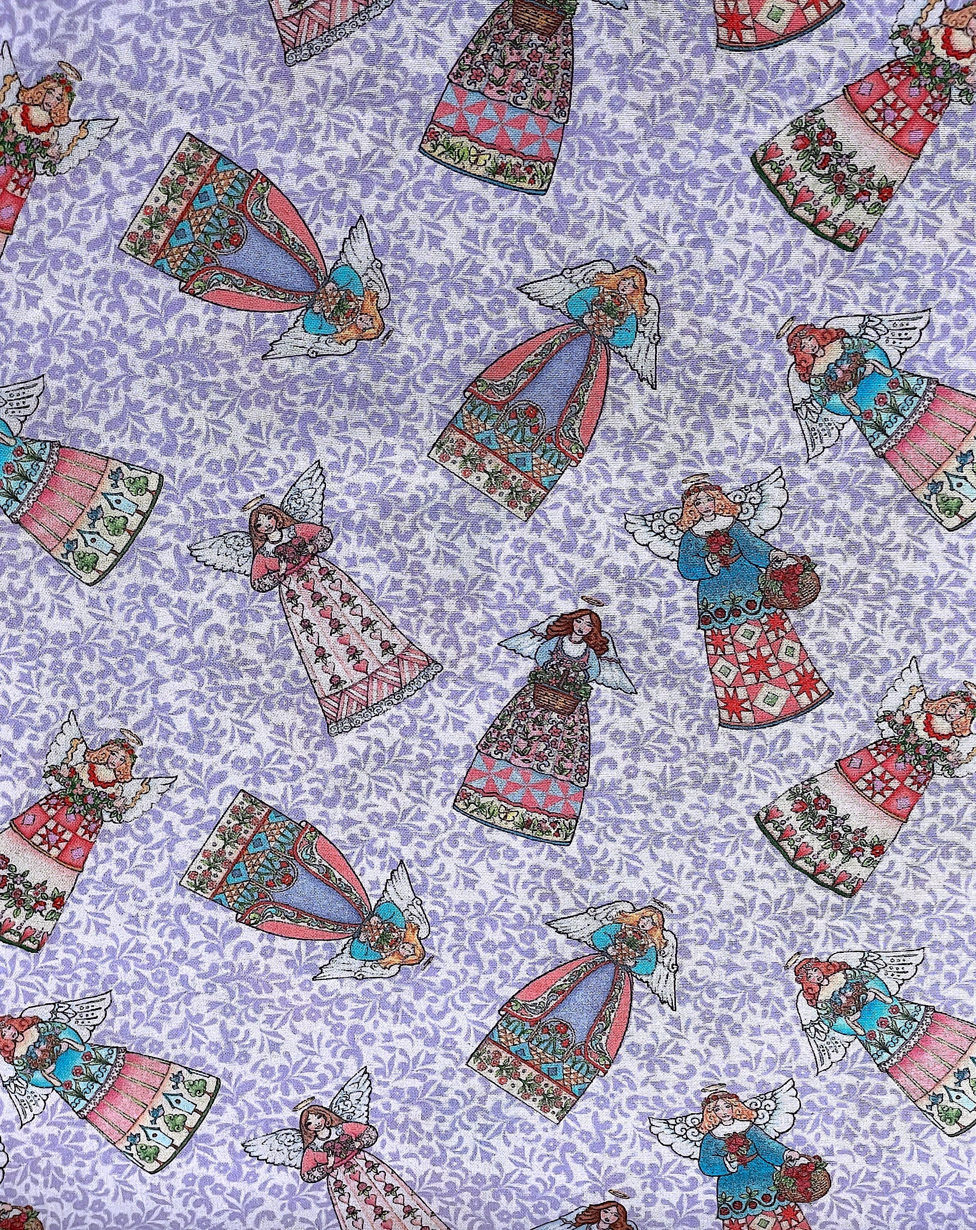 This fabric is part of the Garden Angel collection.&nbsp; This purple cotton fabric is covered with angels.