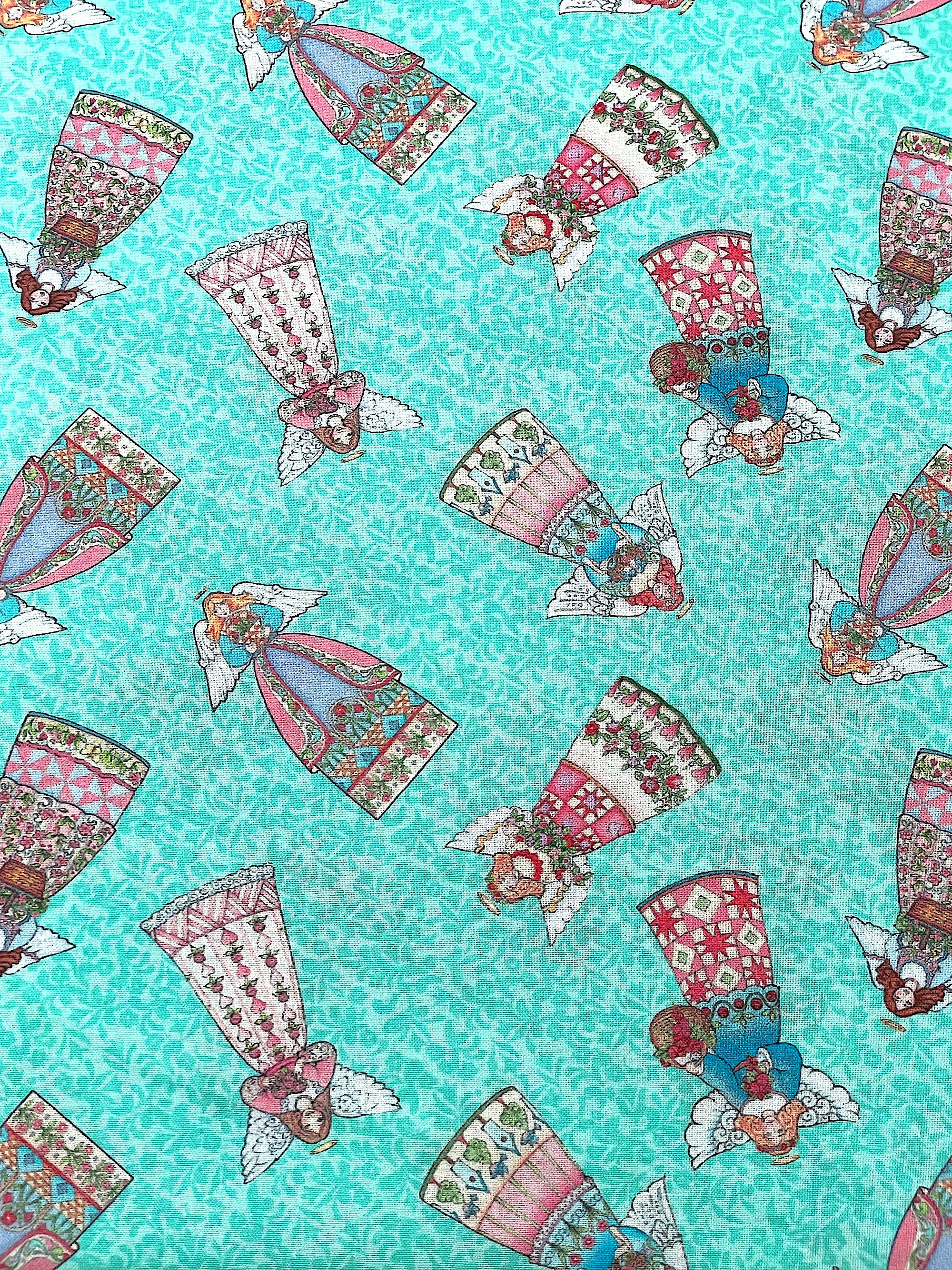 This fabric is part of the Garden Angel collection.&nbsp; This turquoise cotton fabric is covered with angels.
