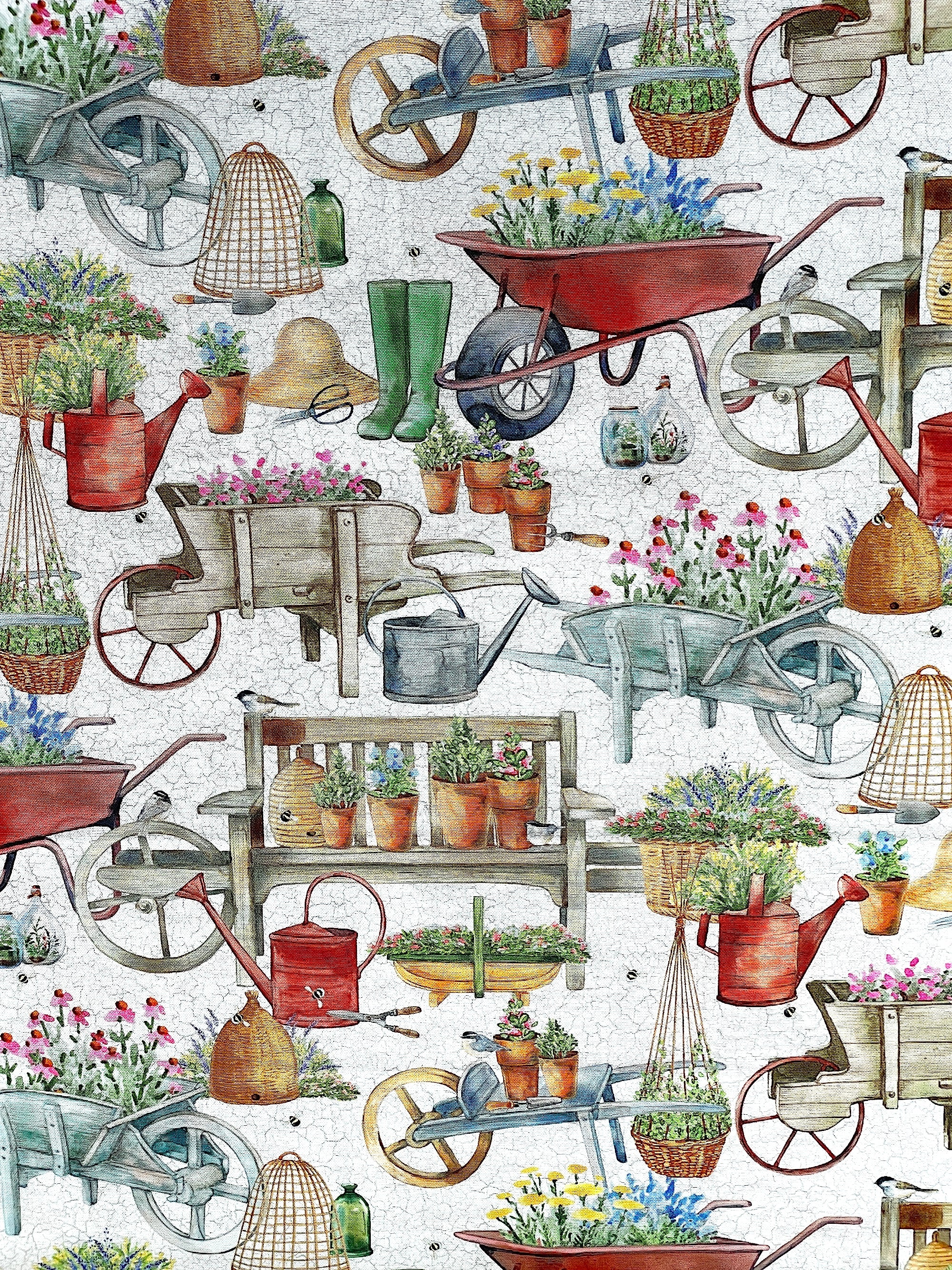 This fabric is part of the Plant with Love collection by Northcott fabrics.&nbsp; This white fabric is covered with watering cans, wheelbarrows of flowers, benches with plants in pots, boots, plant pruners and more