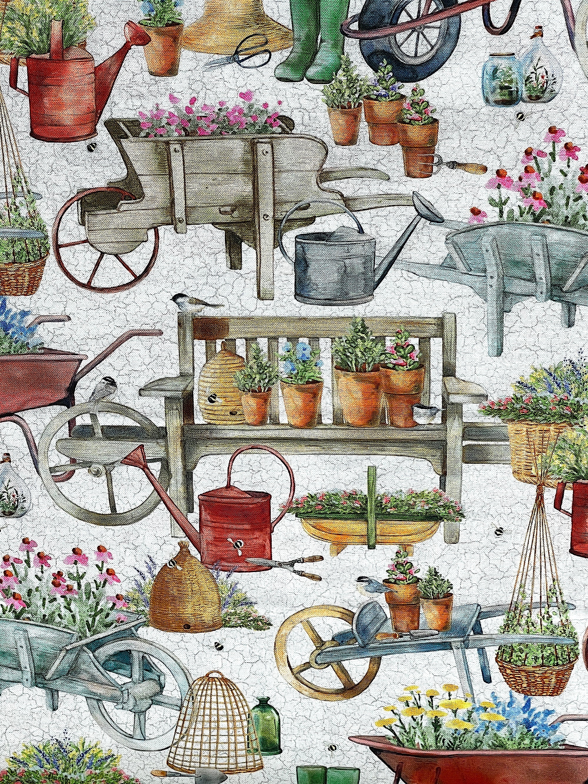 Close up of benches covered with pots of plants, watering cans and more.