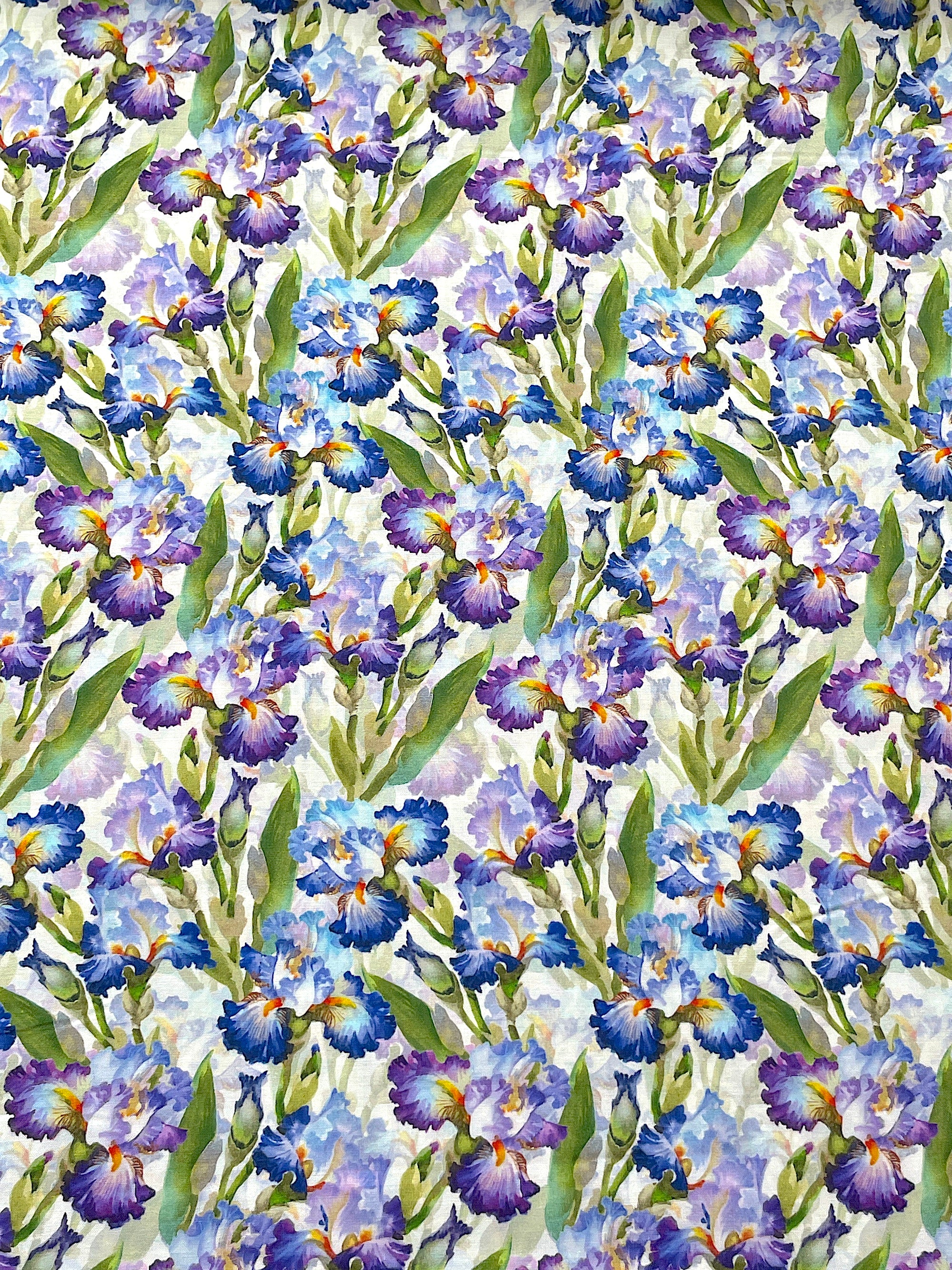 This white fabric is part of the Decoupage collection.&nbsp; This cotton fabric is covered with purple and blue iris flowers.