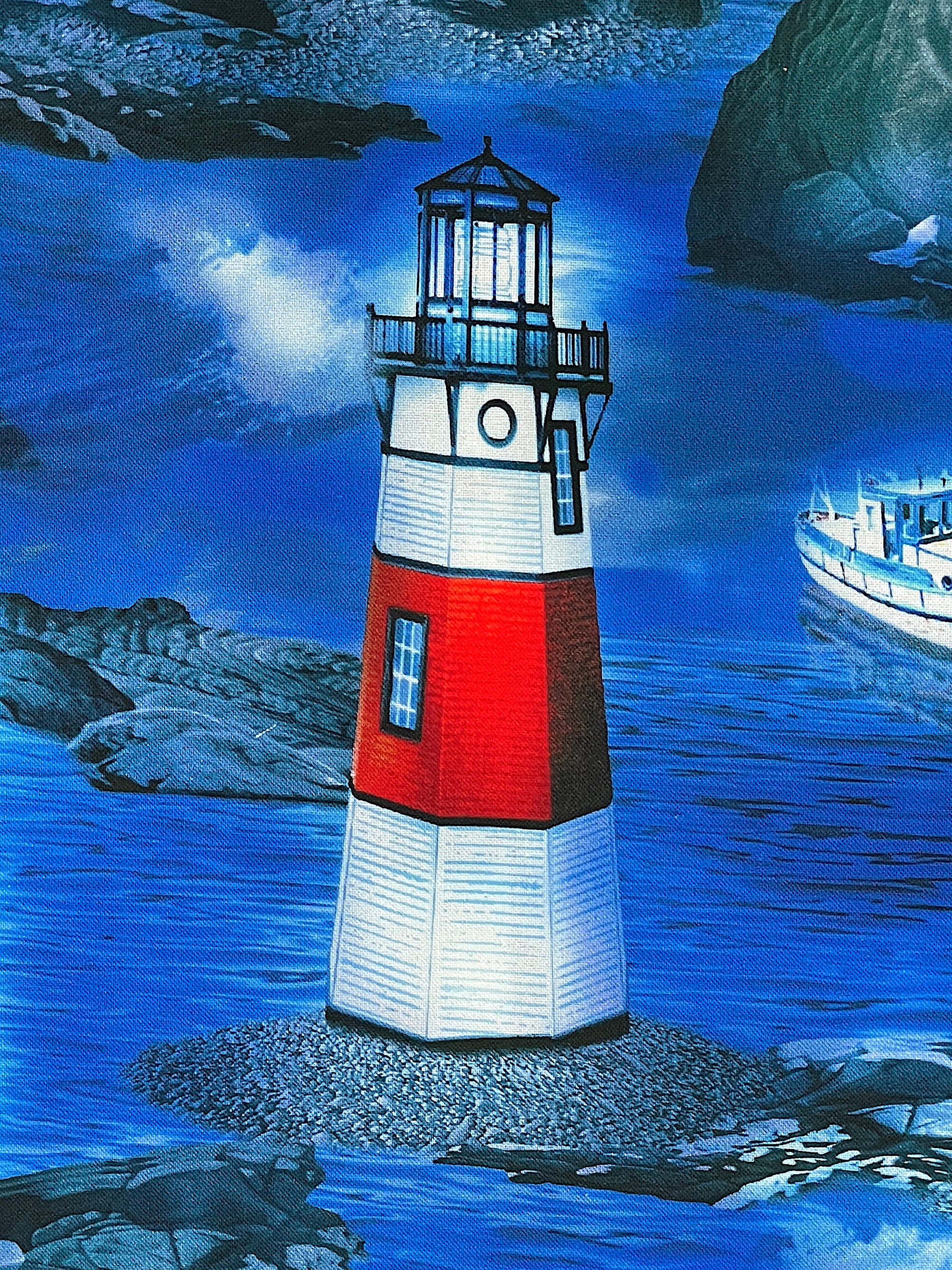 Close up of a red and white lighthouse with a boat in the background.