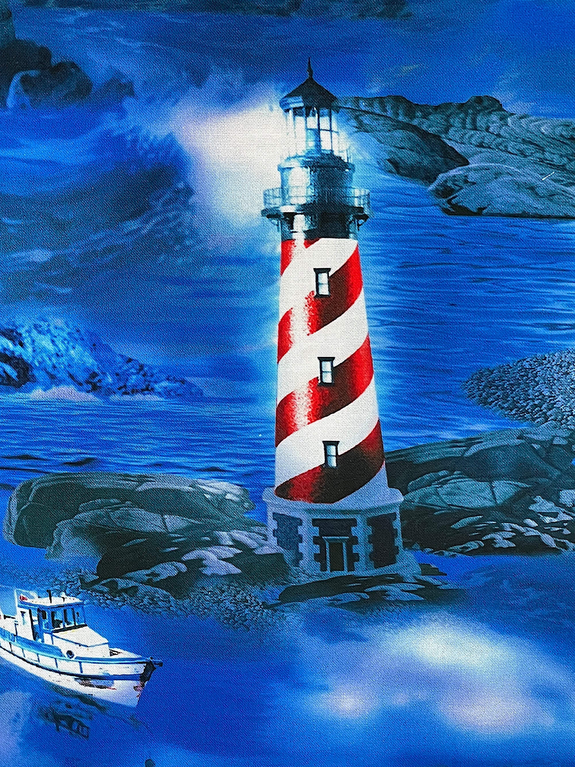 Close up oa a red and white lighthouse in the deep blue sea.