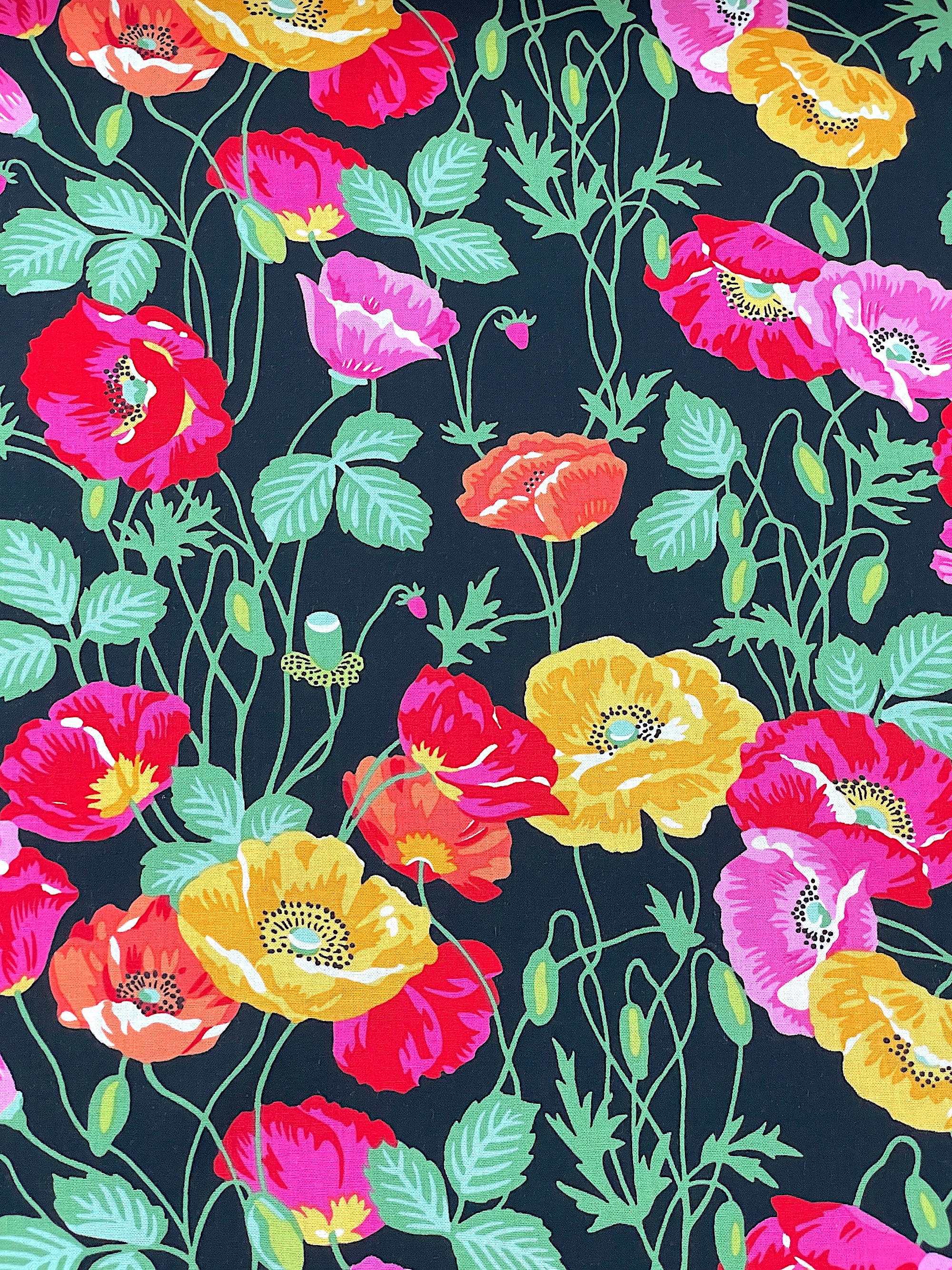 This black&nbsp; cotton fabric is covered with red, orange, pink and yellow poppies and green leaves and stems.