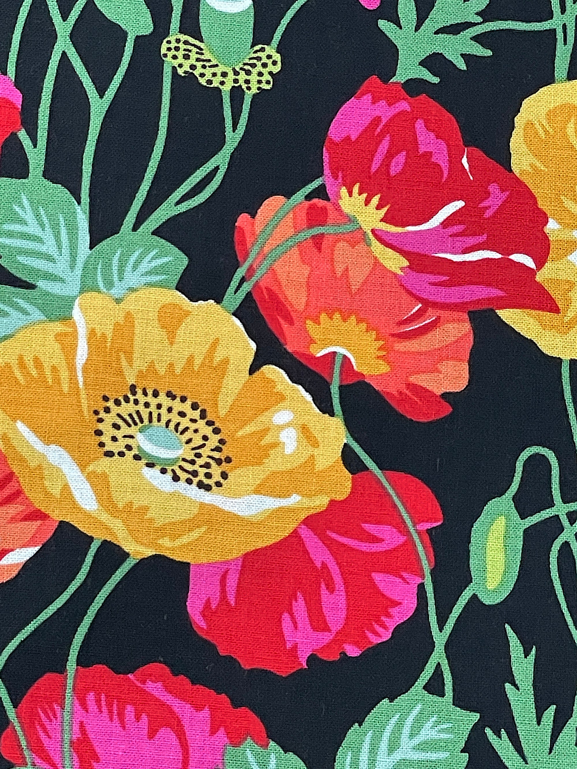 Close up of yellow, red and orange poppies.