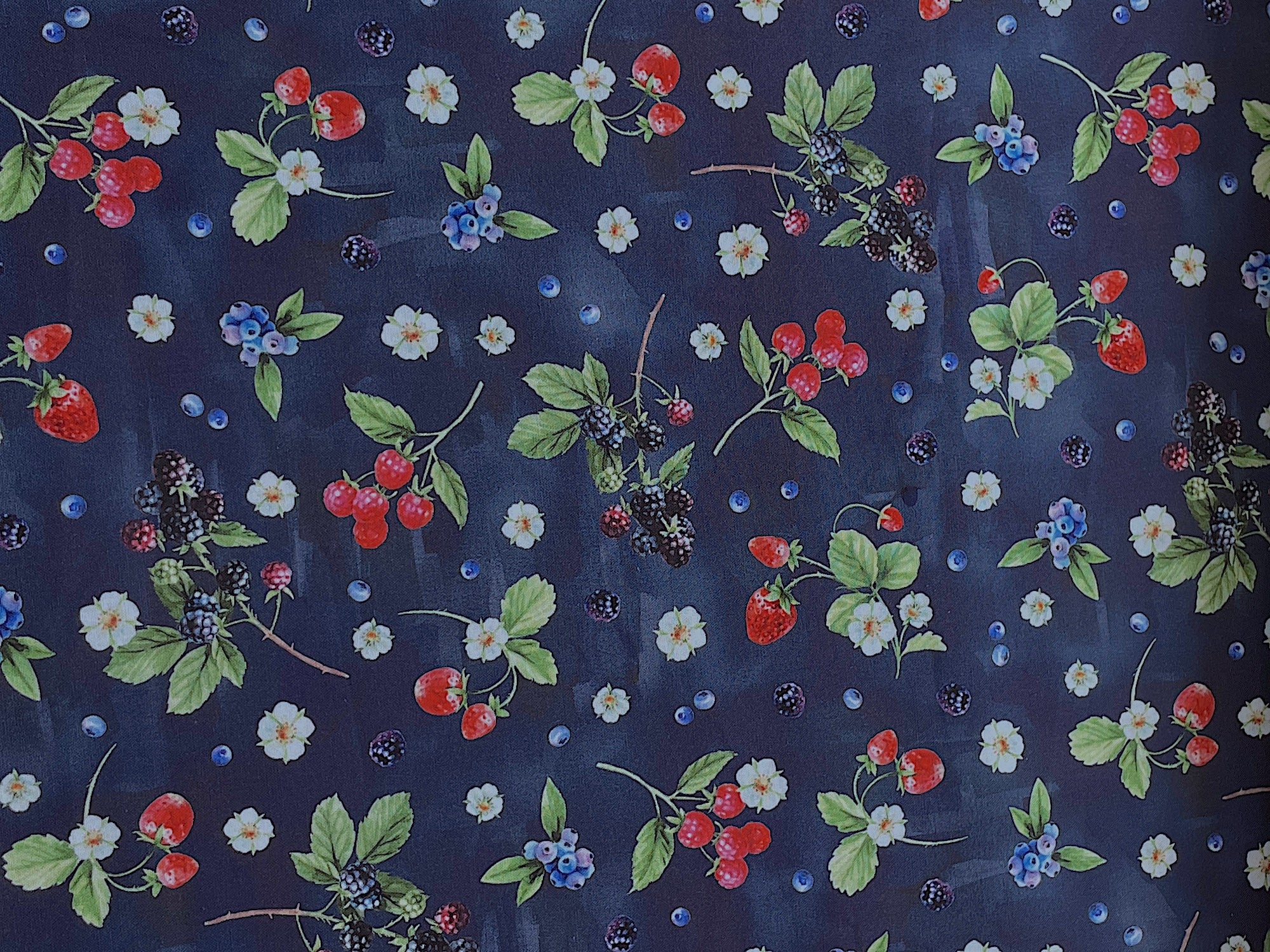 This royal blue fabric is covered with strawberries, raspberries, blackberries and blueberries.&nbsp; This fabric is part of the Dash of Love collection by Hoffman Fabrics.