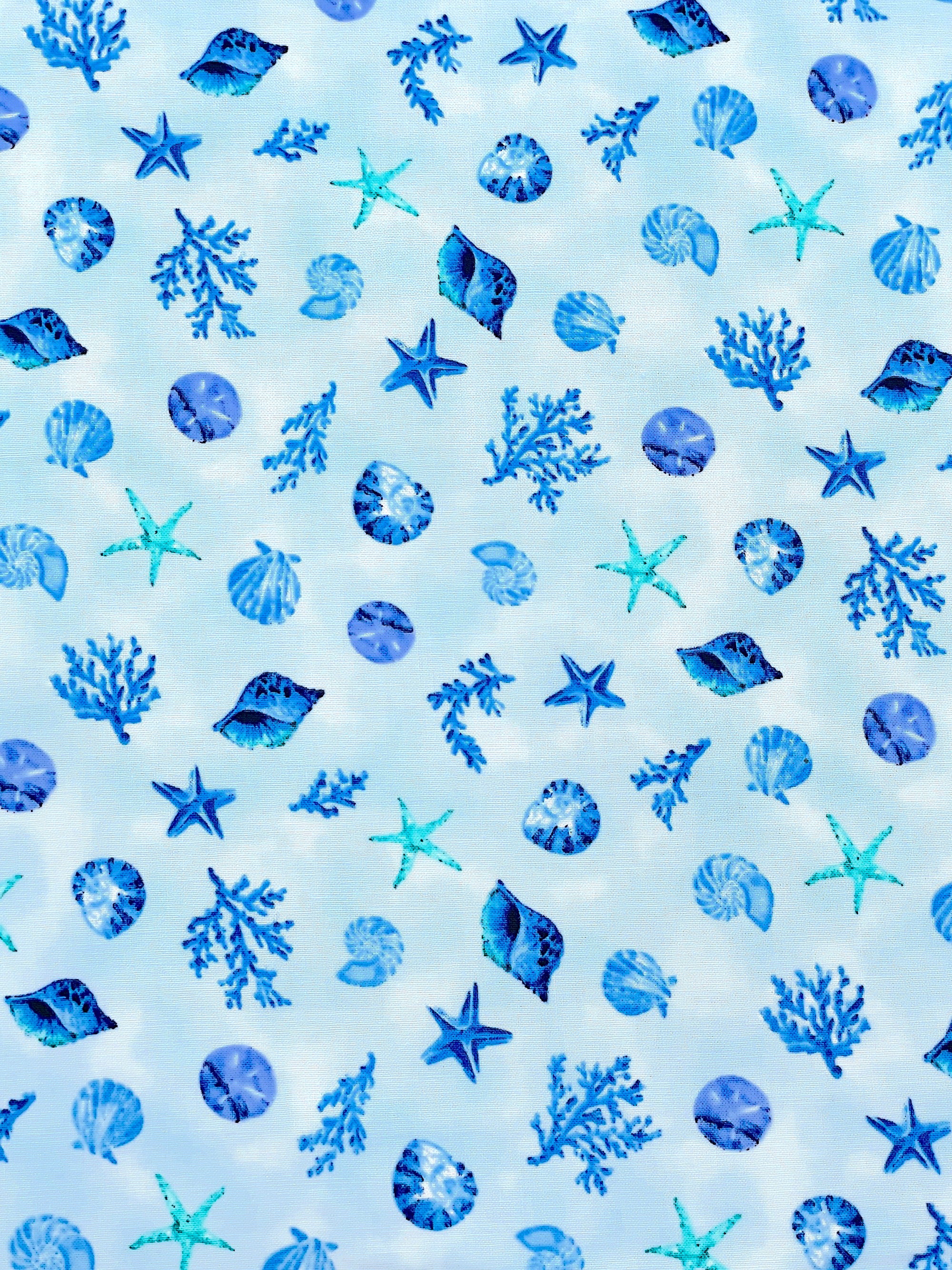This cotton fabric is part of The Sea is Calling collection.&nbsp; This fabric is covered with starfish, coral, sea shells and more.