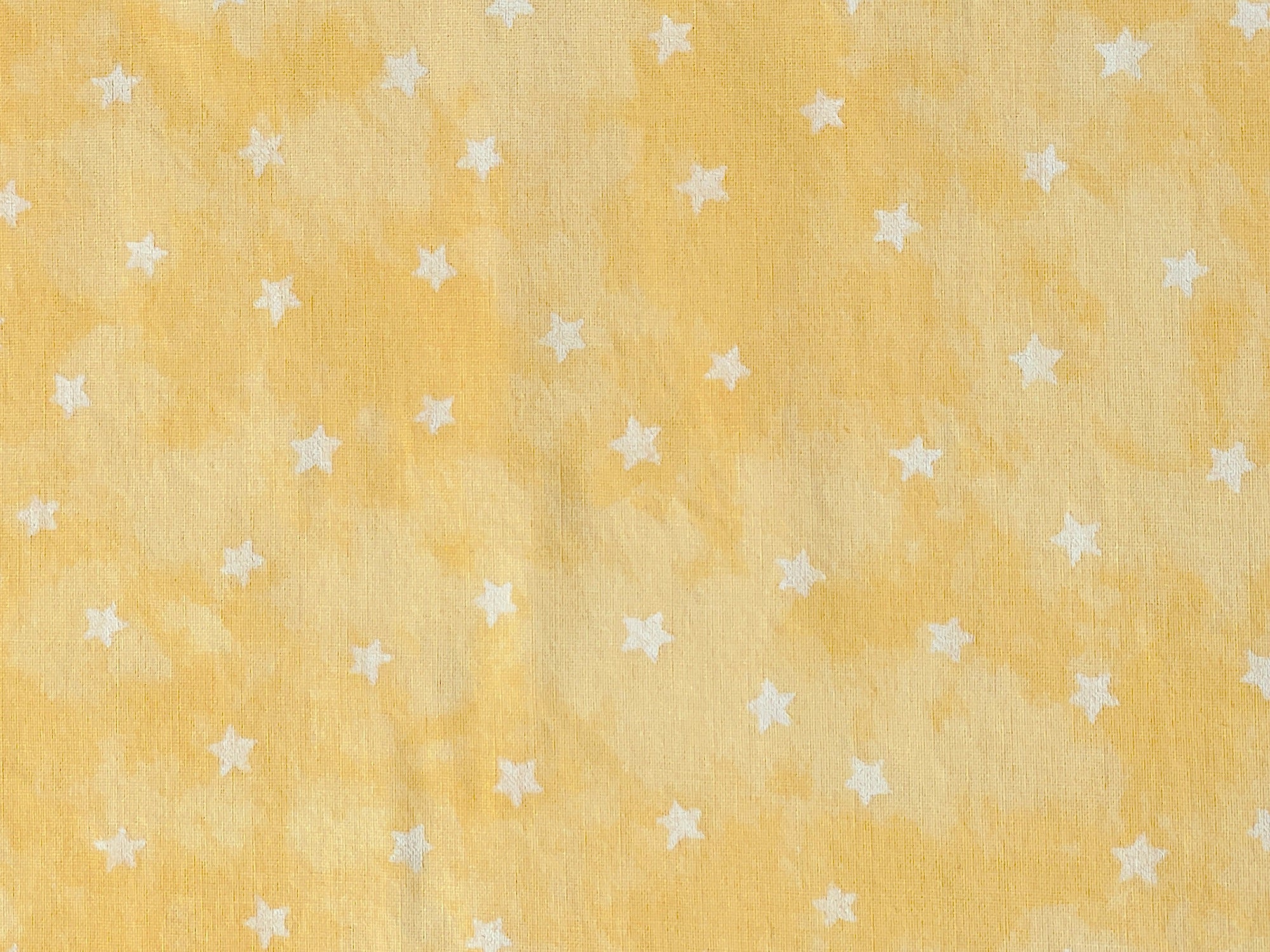 yellow fabric with white stars