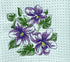 Embroidered design of purple flowers with green leaves on a textured fabric background