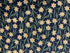 Cotton fabric covered with small daffodils.