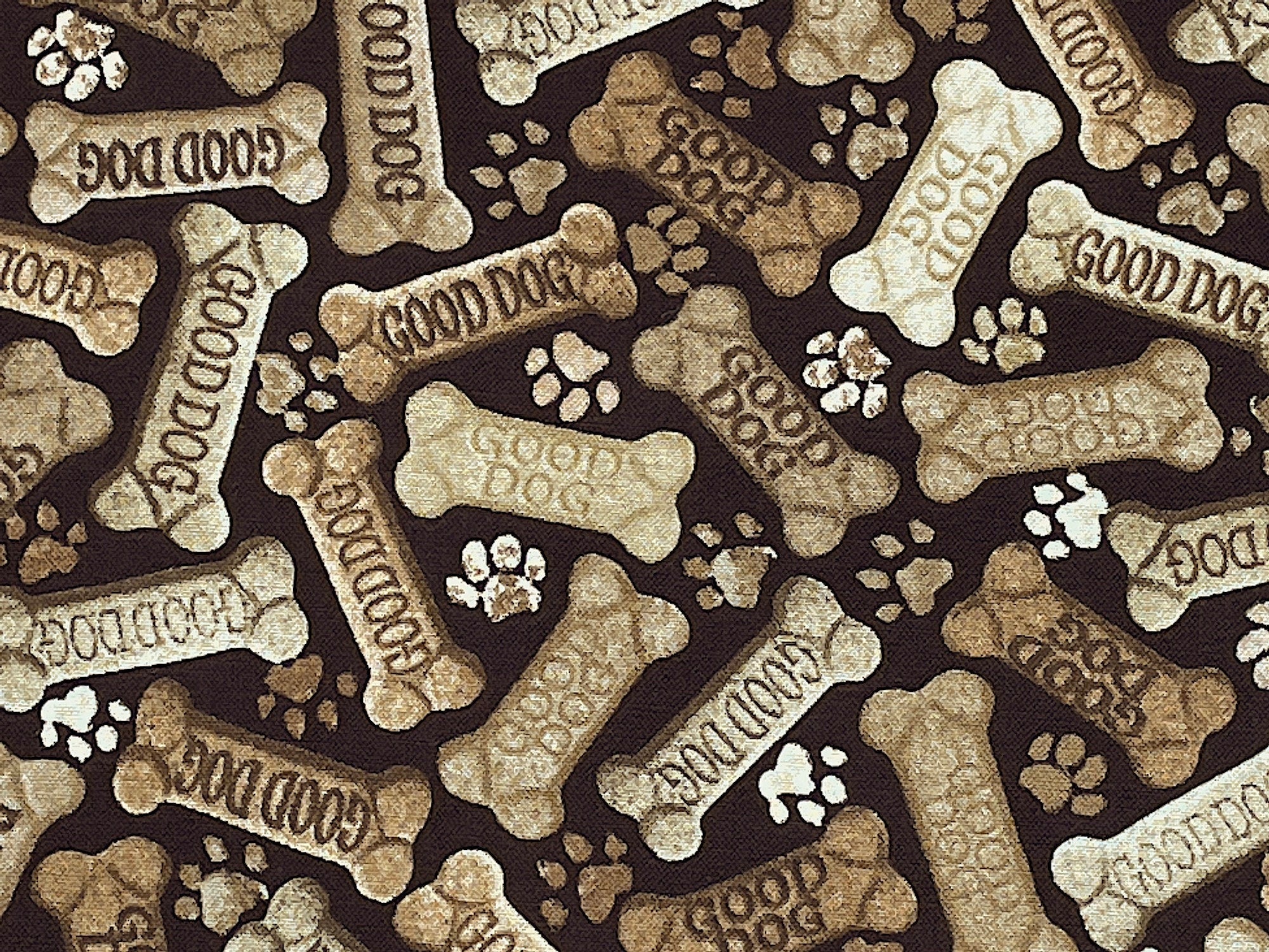 Close up of dog bones that have the saying good dog on them