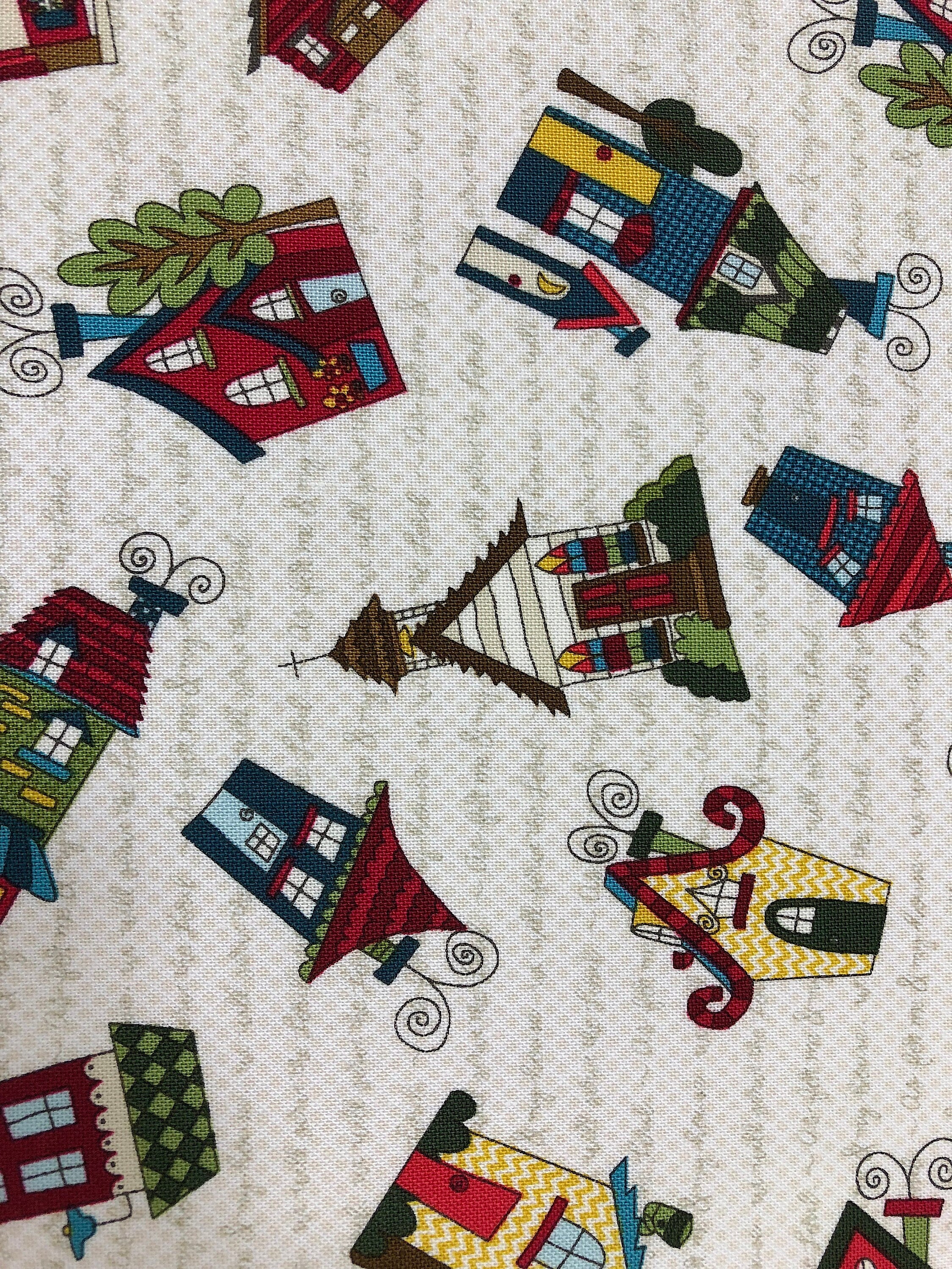 Tossed Houses all over an off white background. This fabric is called Covered in Truth by Leanne and Kaytlyn Anderson