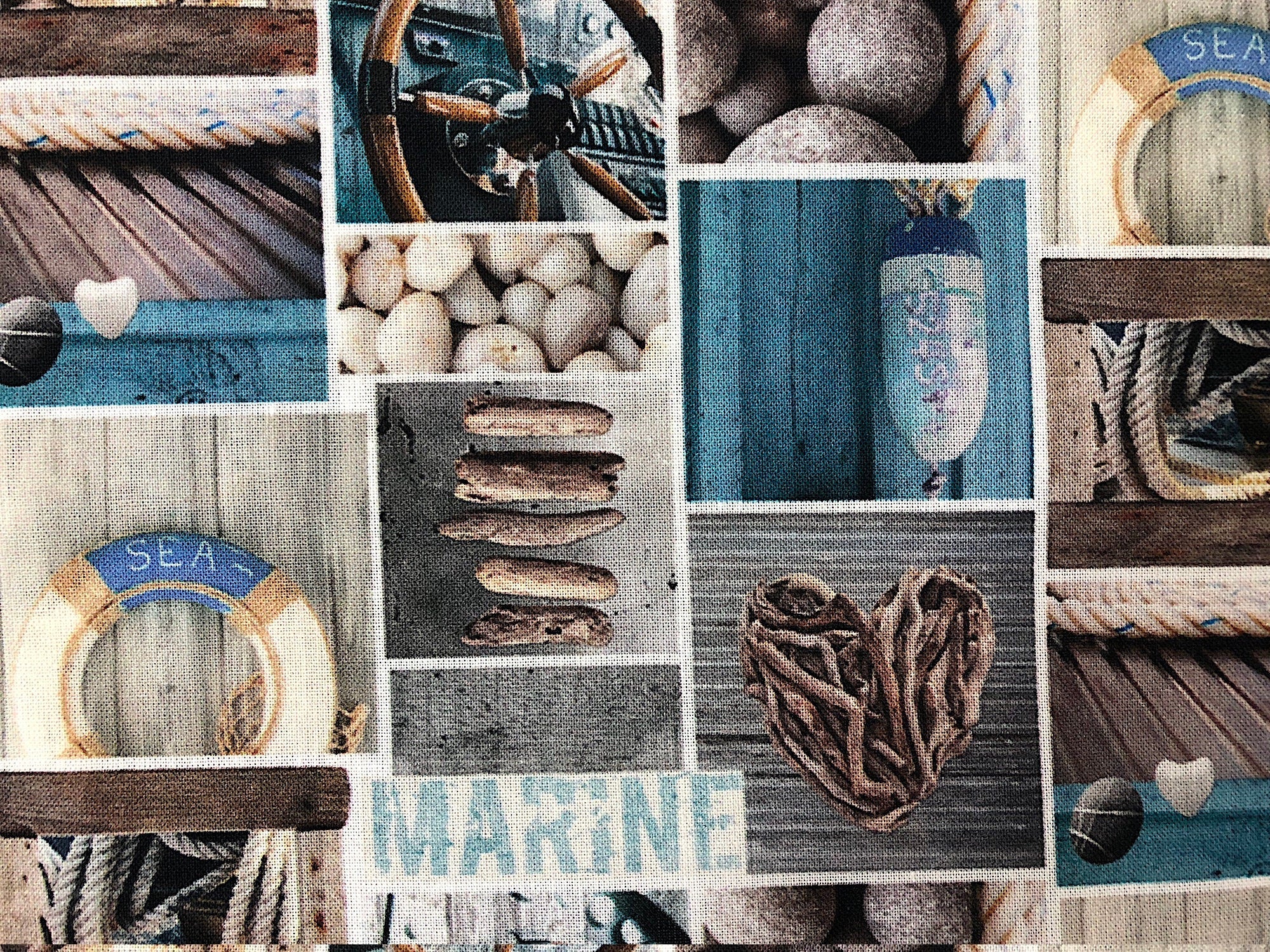 Close up of driftwood, rocks ad other nautical items.