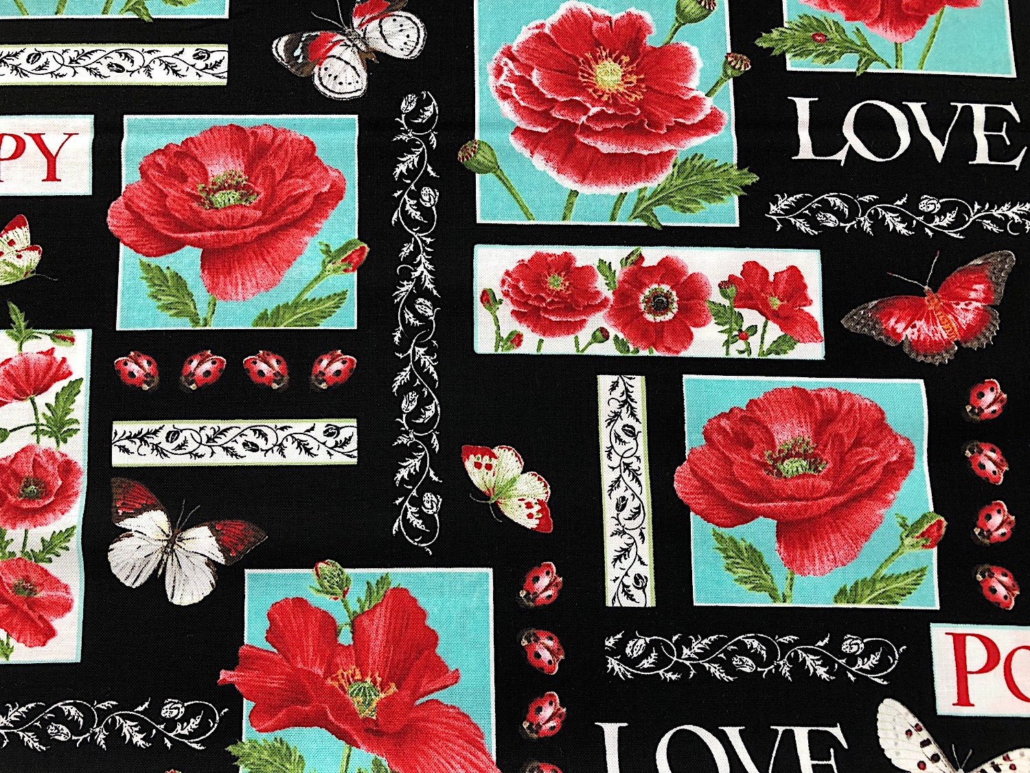 This fabric is part of the Poppy Perfection line. Poppies, butterflies, ladybugs are all over this black fabric. Love and Poppy are also printed on the fabric