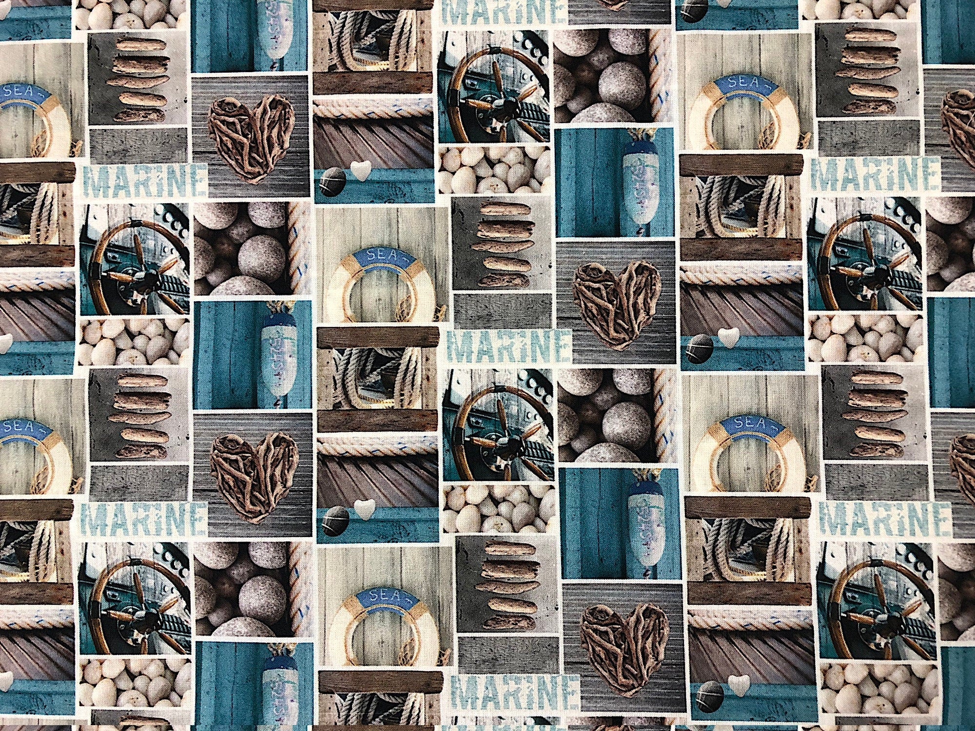 This nautical ocean fabric has drift wood, rocks, and beach related items.