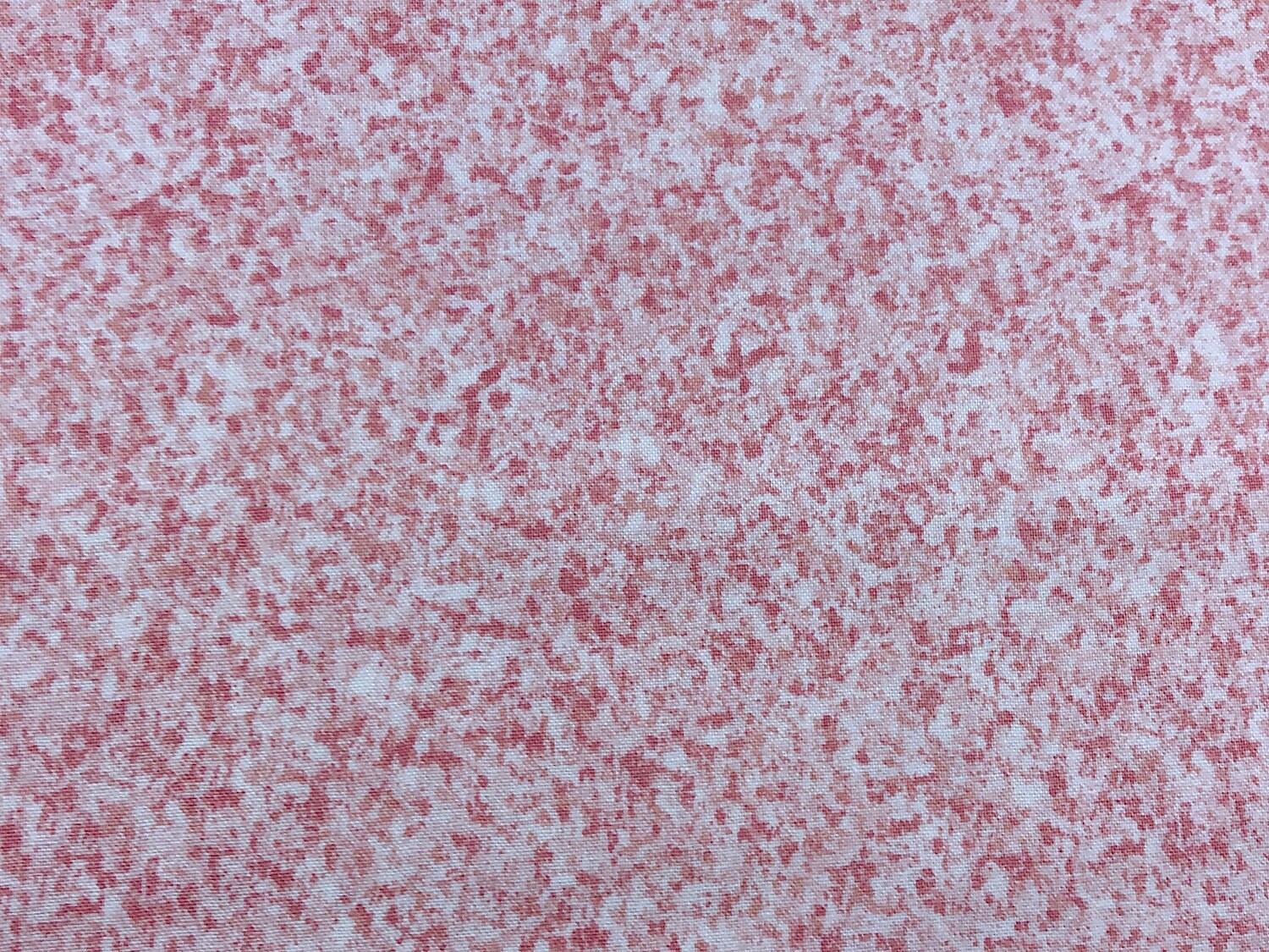 This is a blender fabric which is covered with shades of pink.