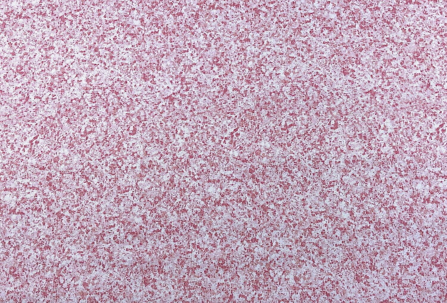 Cotton fabric covered with shades of pink.