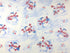 This fabric is covered with snowmen wearing scarves. Some of the snowmen are holding patriotic ornaments, some are by birdhouses and others are ringing a bell.