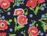 This fabric has red poppies on a black background.