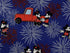 Close up of a red truck with Mickey and Minnie Mouse and fireworks.