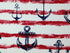 Blue anchors and red stripes on a cream background and is called Anchor Canvas. This is a heavy canvas fabric, perfect for throw pillows.