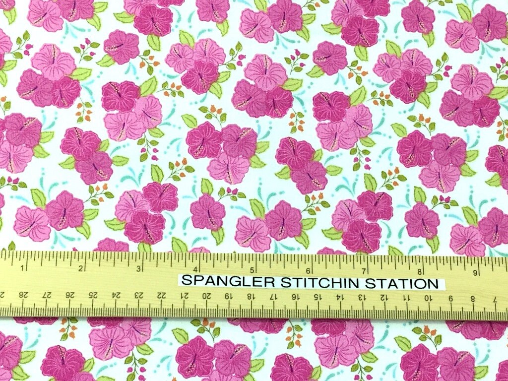 Ruler on fabric to show the size of the flowers.