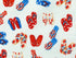 Close up of red, white and blue flip flops on a white background.