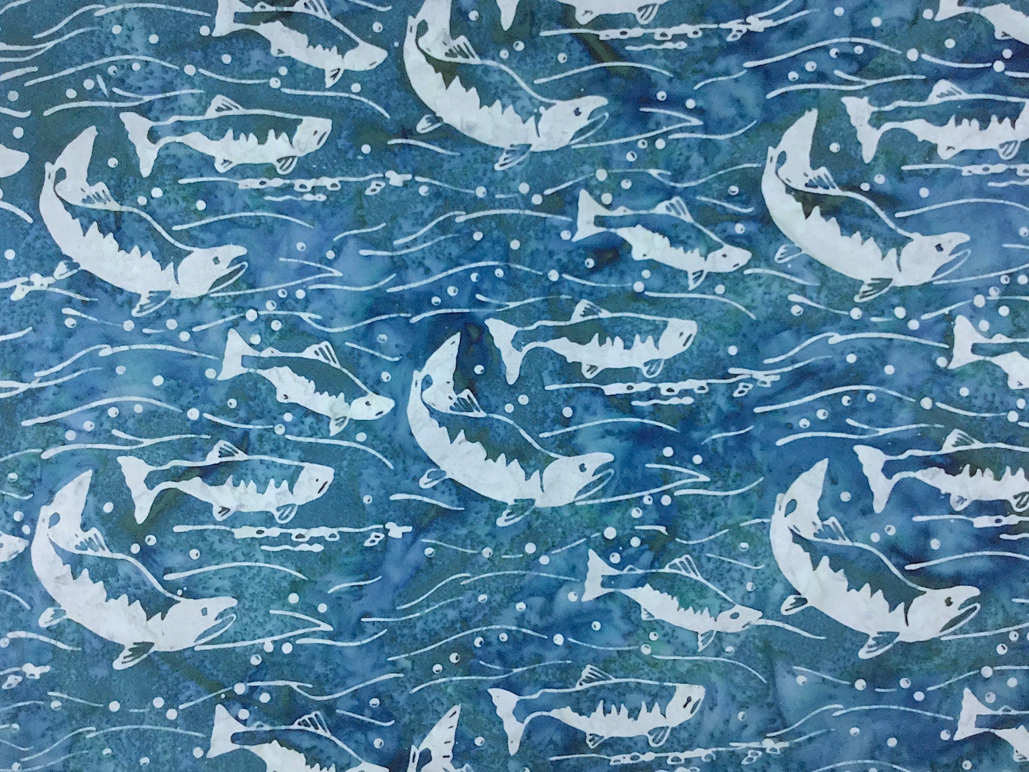 This Green fabric is called Splash and is covered with fish.
