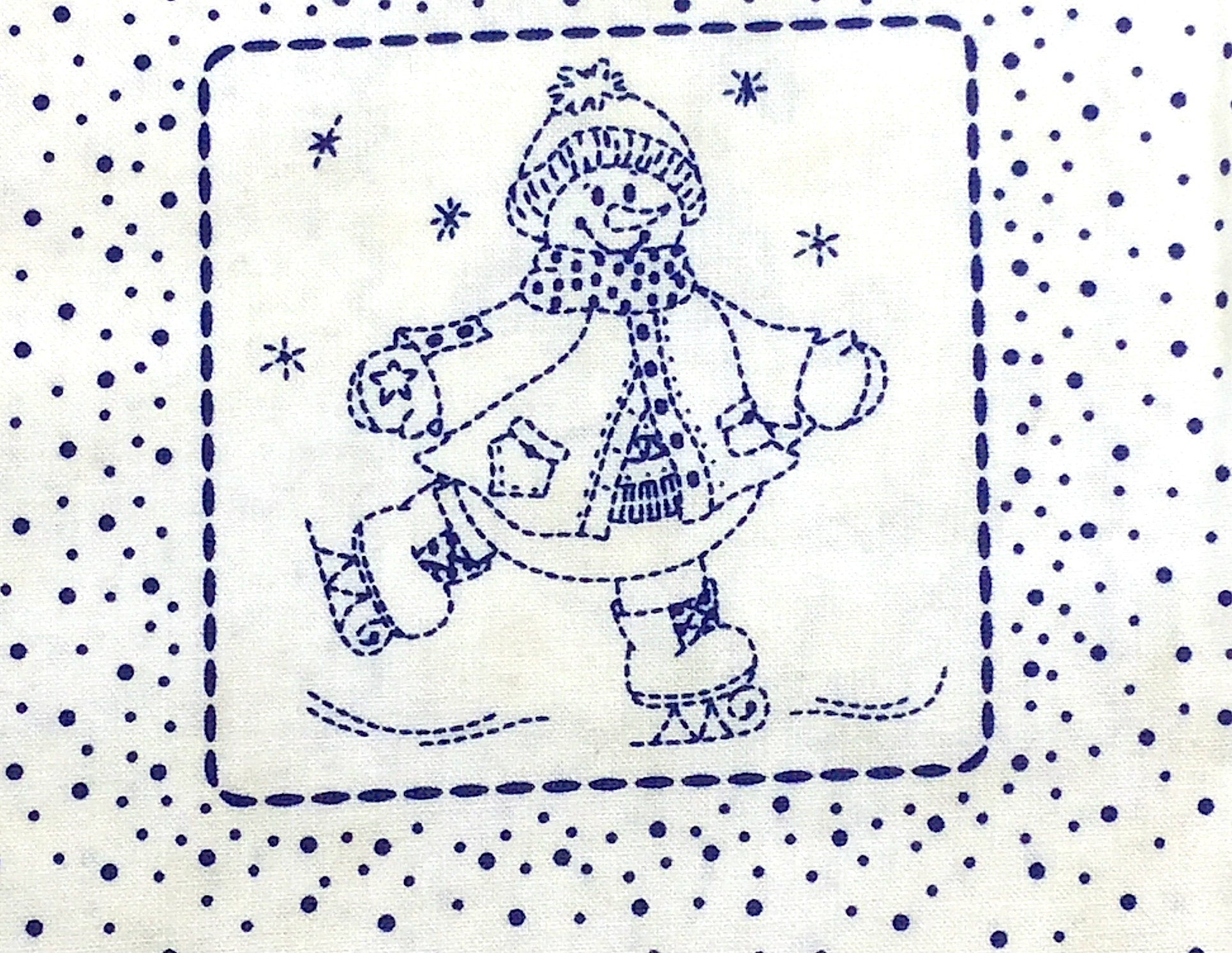 Close up of a snowman that is ice skating.