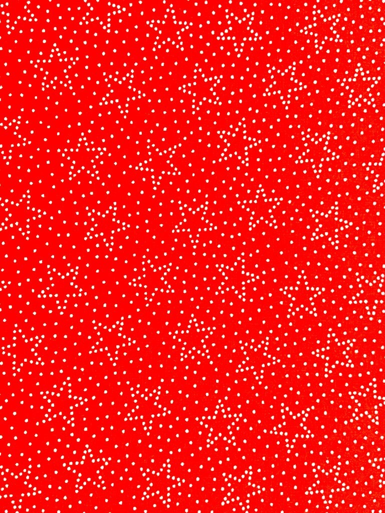 Close up of dot stars on a red background.