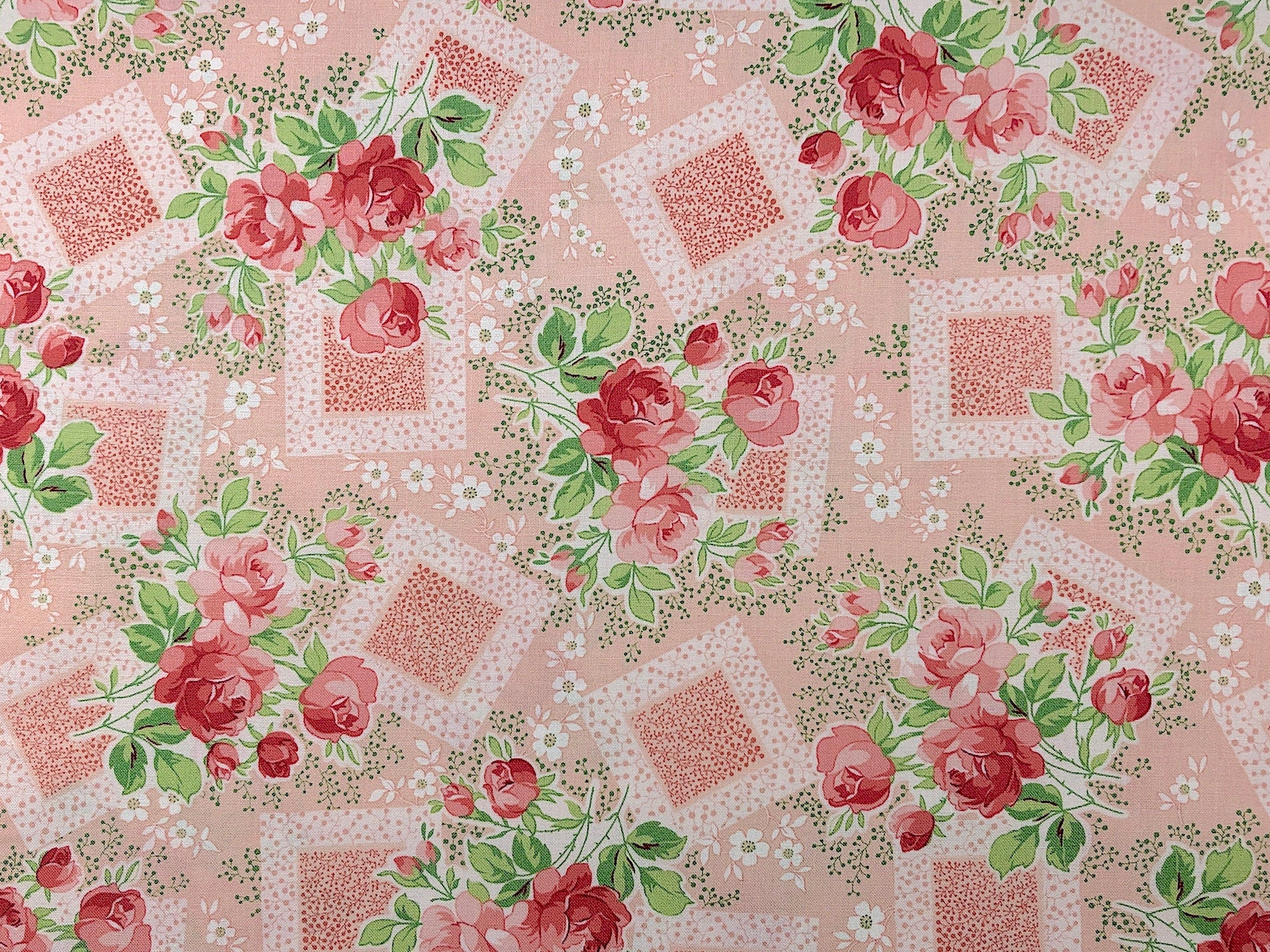 This fabric is called Violets Garden and is covered with peach flowers